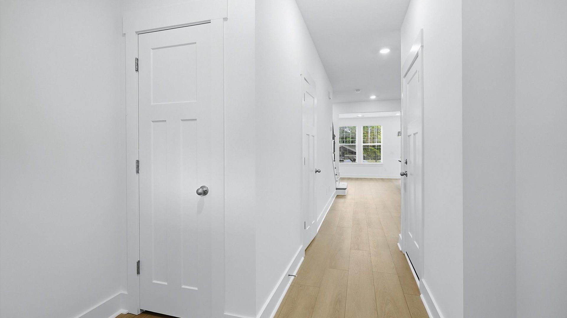 Accomplished hardwood flooring foyer sets the tone for tasteful design throughout the home in NC