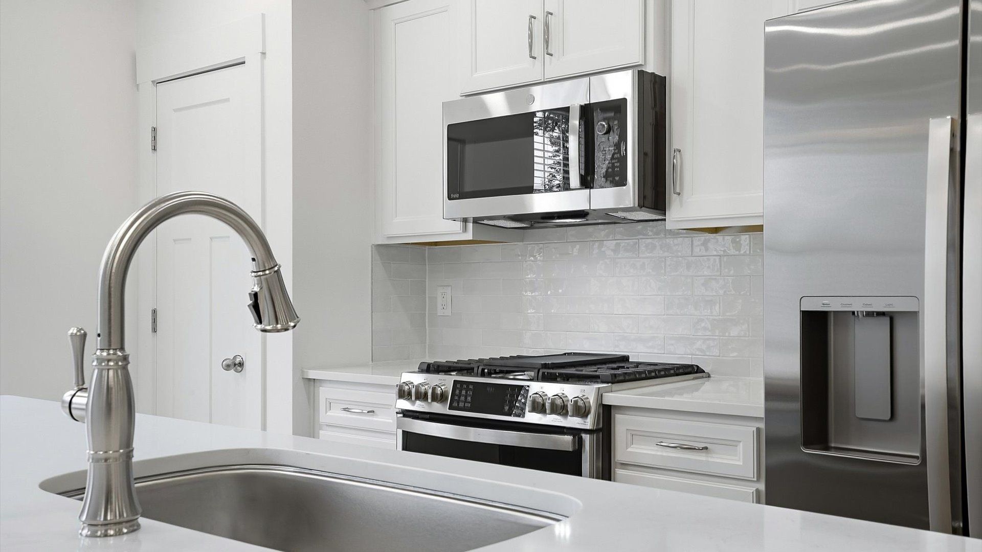 Memorable meals begin in this vibrant kitchen with pendant lighting and a thoughtfully designed island by DRB Homes