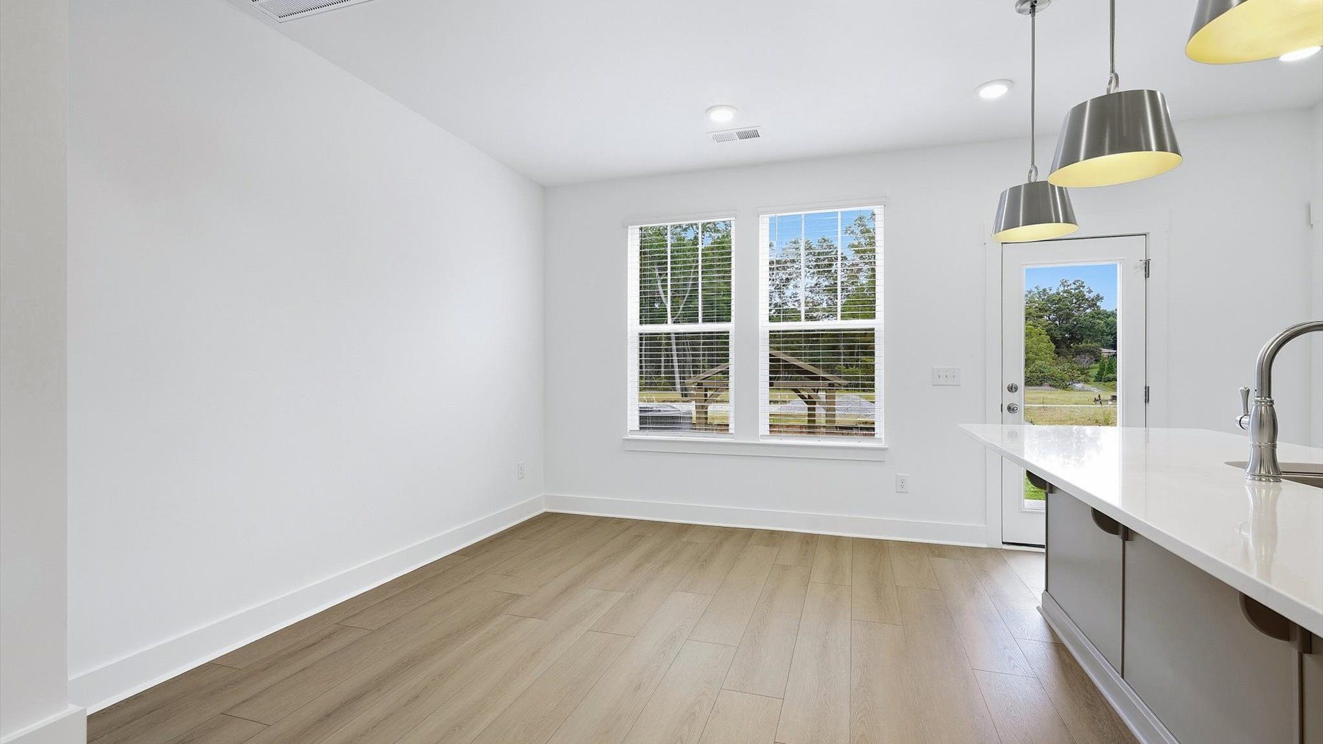 Inviting breakfast area with a seamless connection to the kitchen for everyday living at Brookland Place