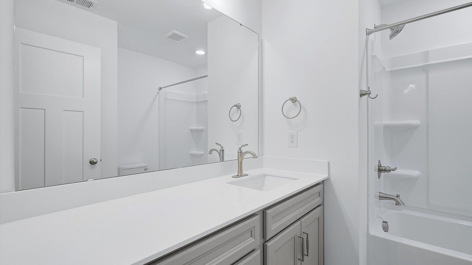 Top-notch bathroom with current fixtures, tasteful materials, and elevated charm at Brookland Place