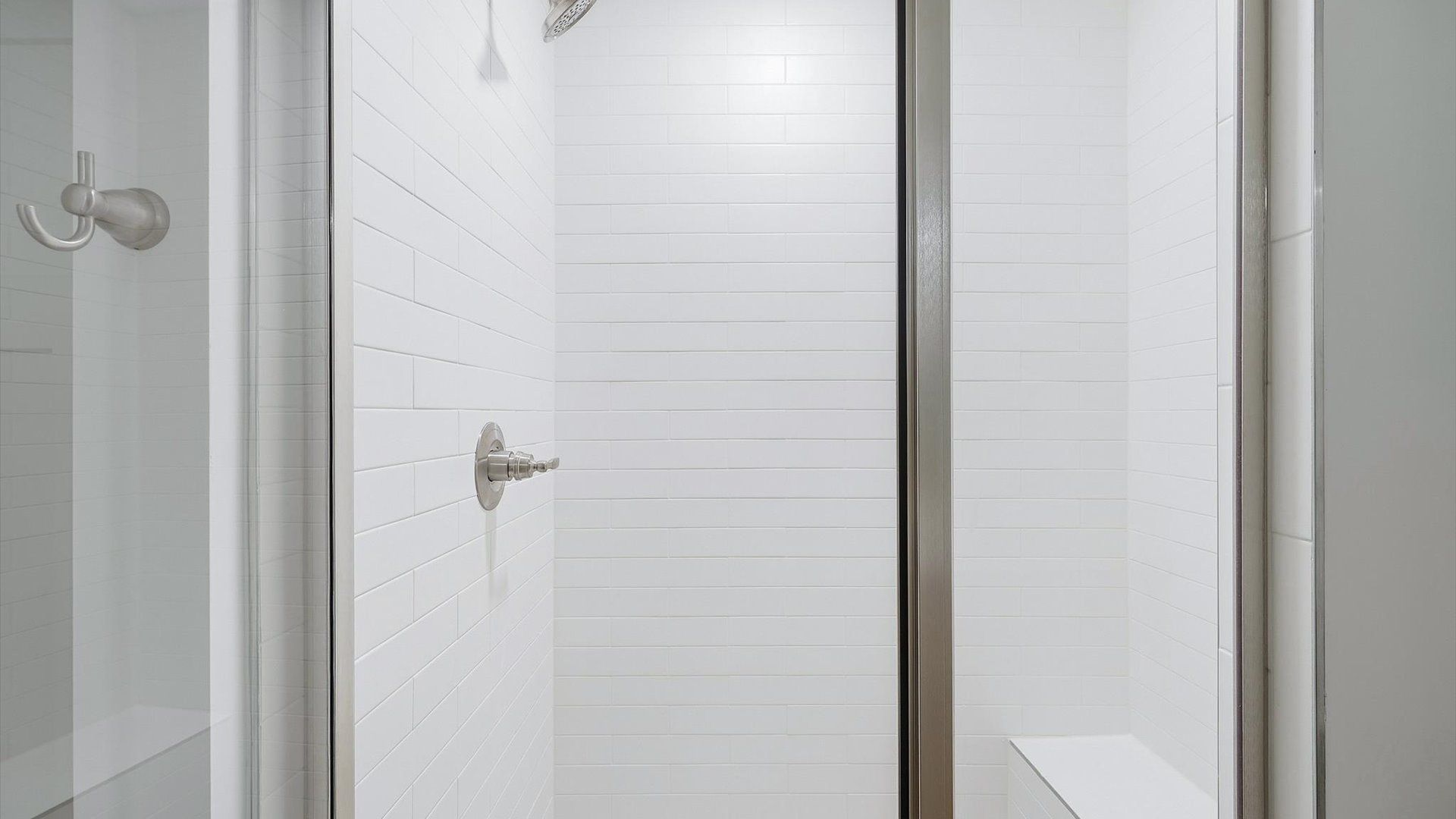 Notable primary bath featuring a walk-in shower and tasteful design touches throughout in Hendersonville, NC
