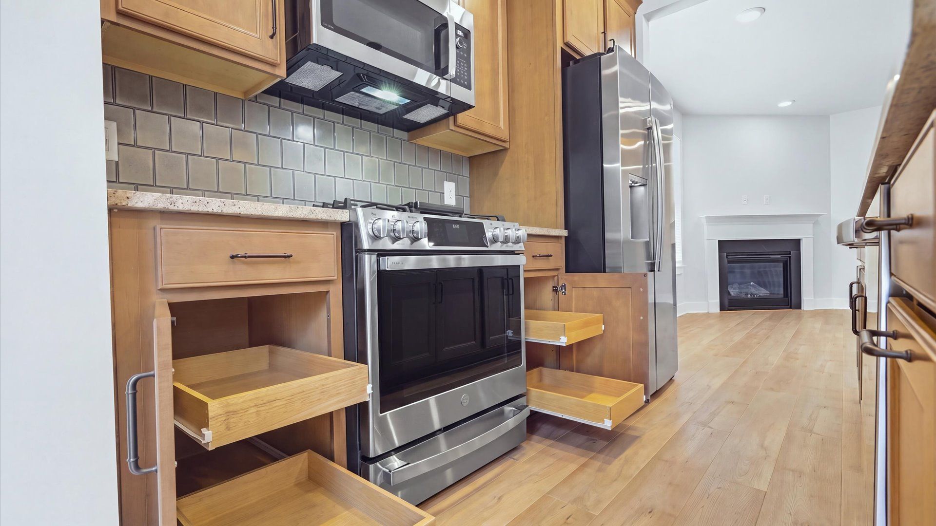 Luxury-inspired kitchen featuring expansive prep space and elegant design elements by DRB Homes