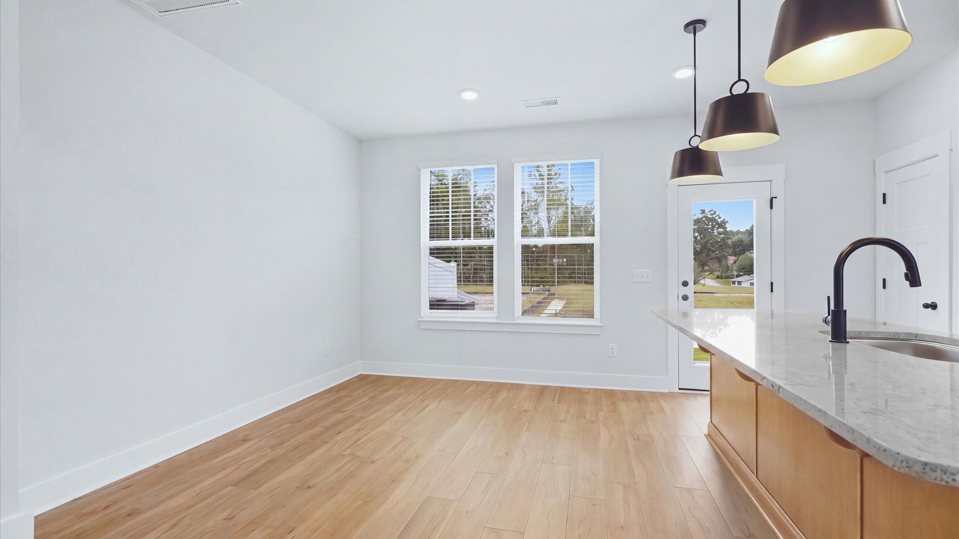 Inviting breakfast area with a seamless connection to the kitchen for everyday living at Brookland Place