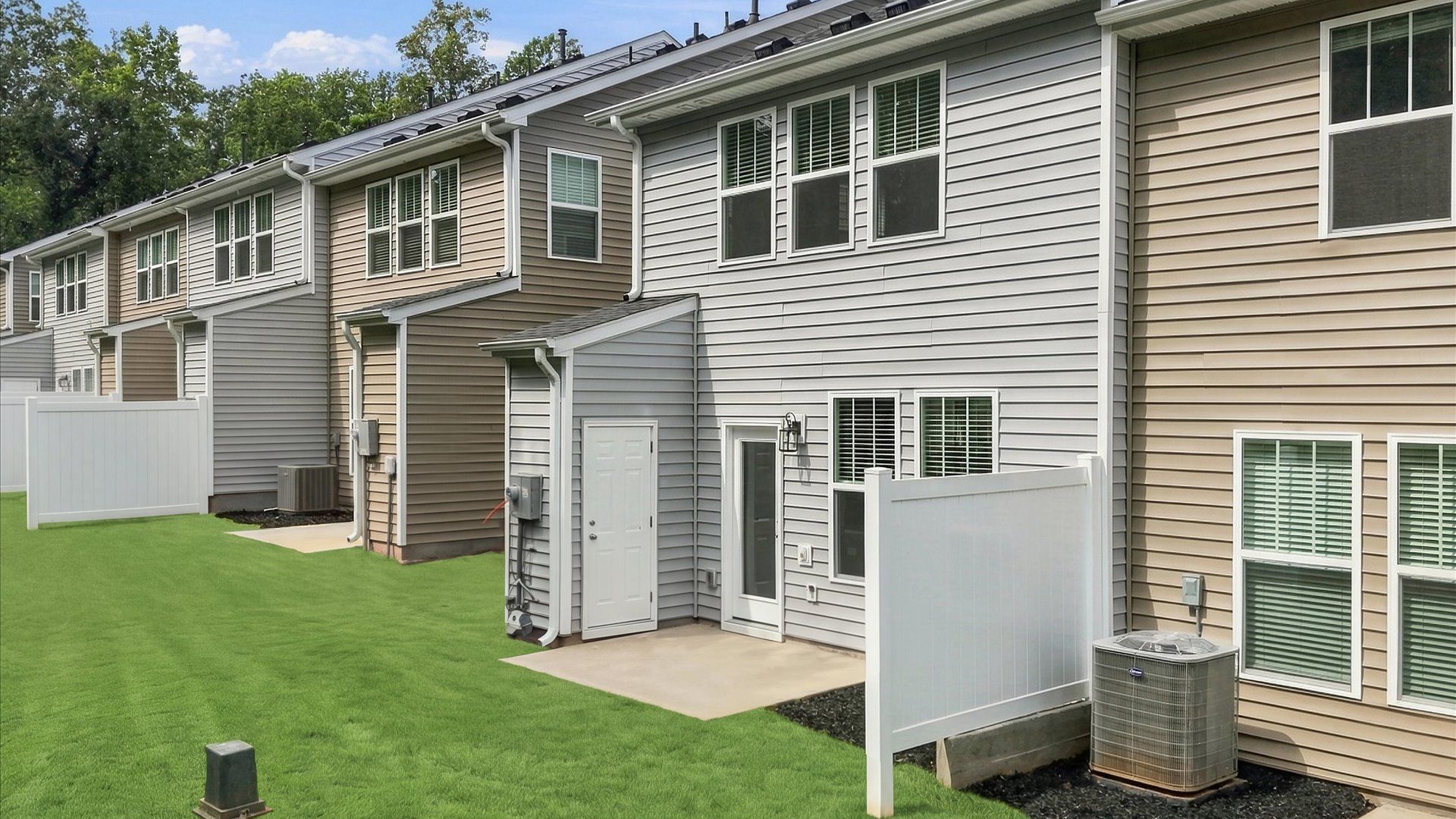 Eye-catching rear exterior with timeless color palette and superior architectural detail by DRB Homes