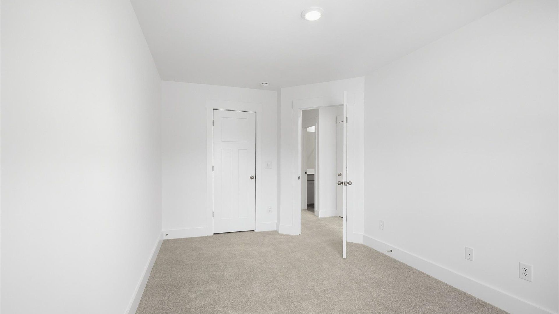 First-class secondary bedroom with comfortable carpeted flooring and generous closet space in Spartanburg, SC