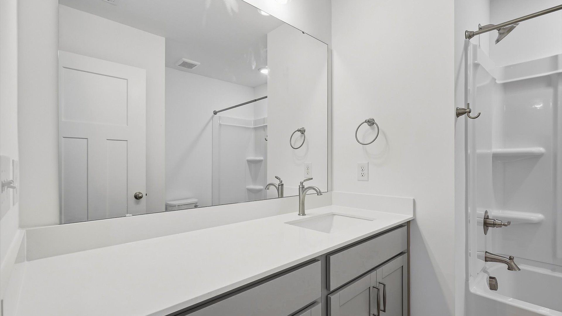 Accomplished full bath designed with both comfort and sophistication in mind by DRB Homes