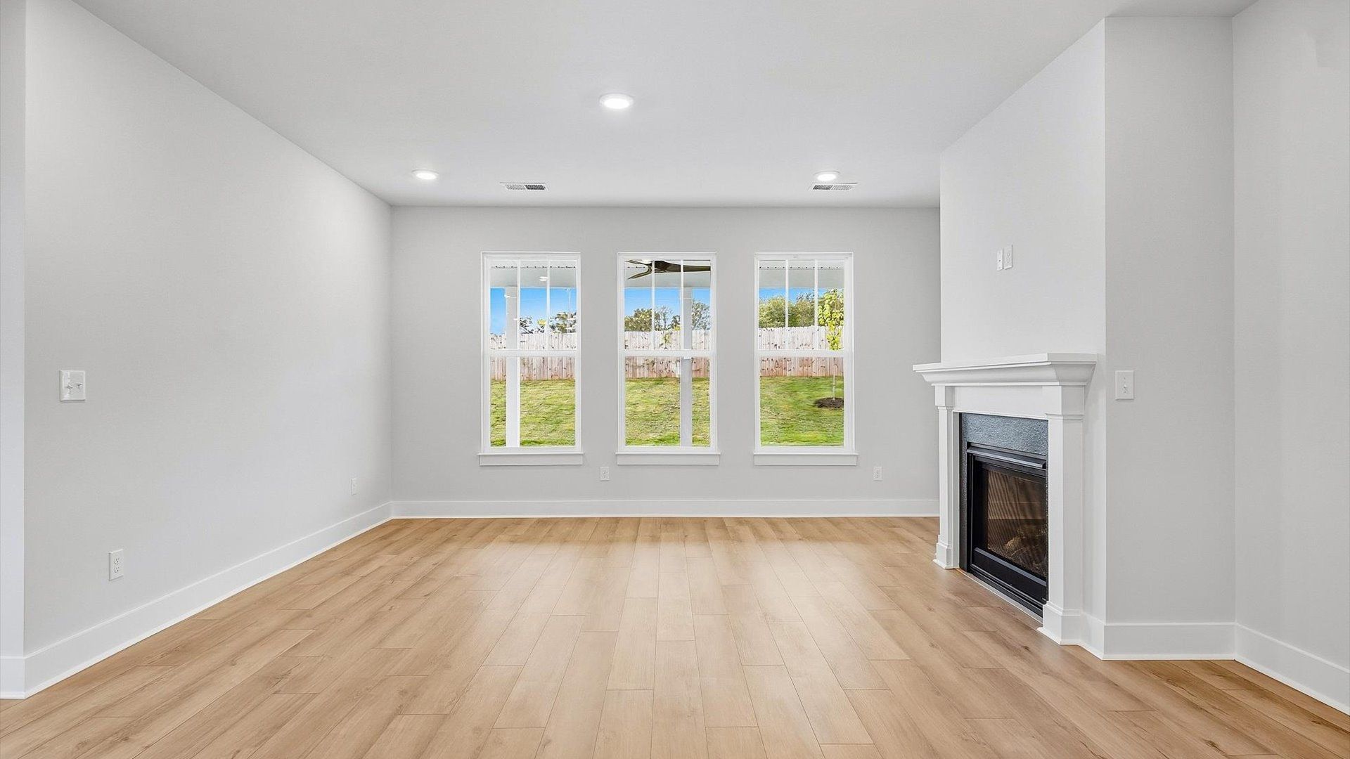 Memorable moments begin in this elegant, open family room with hardwood flooring and refined finishes in Piedmont, SC