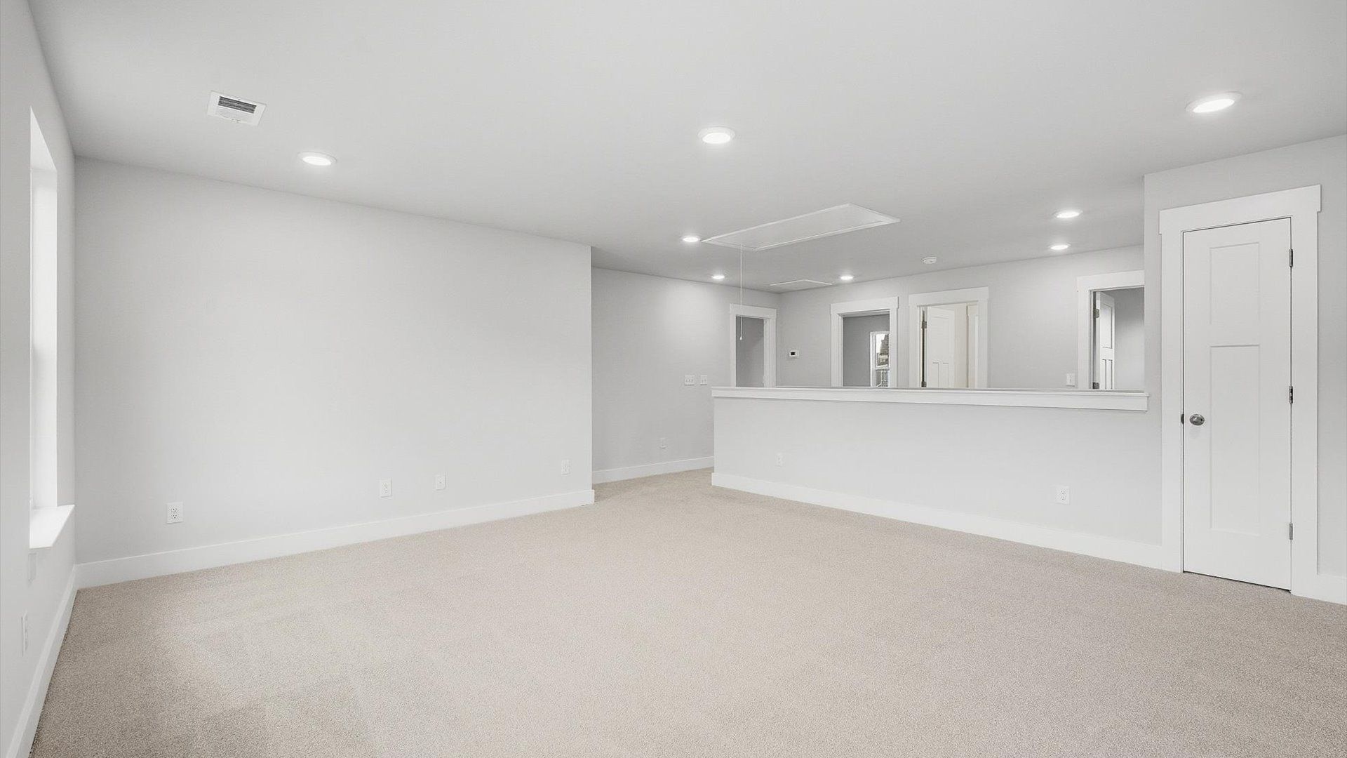 Stylish loft retreat with carpeted flooring and accomplished architectural detail by DRB Homes