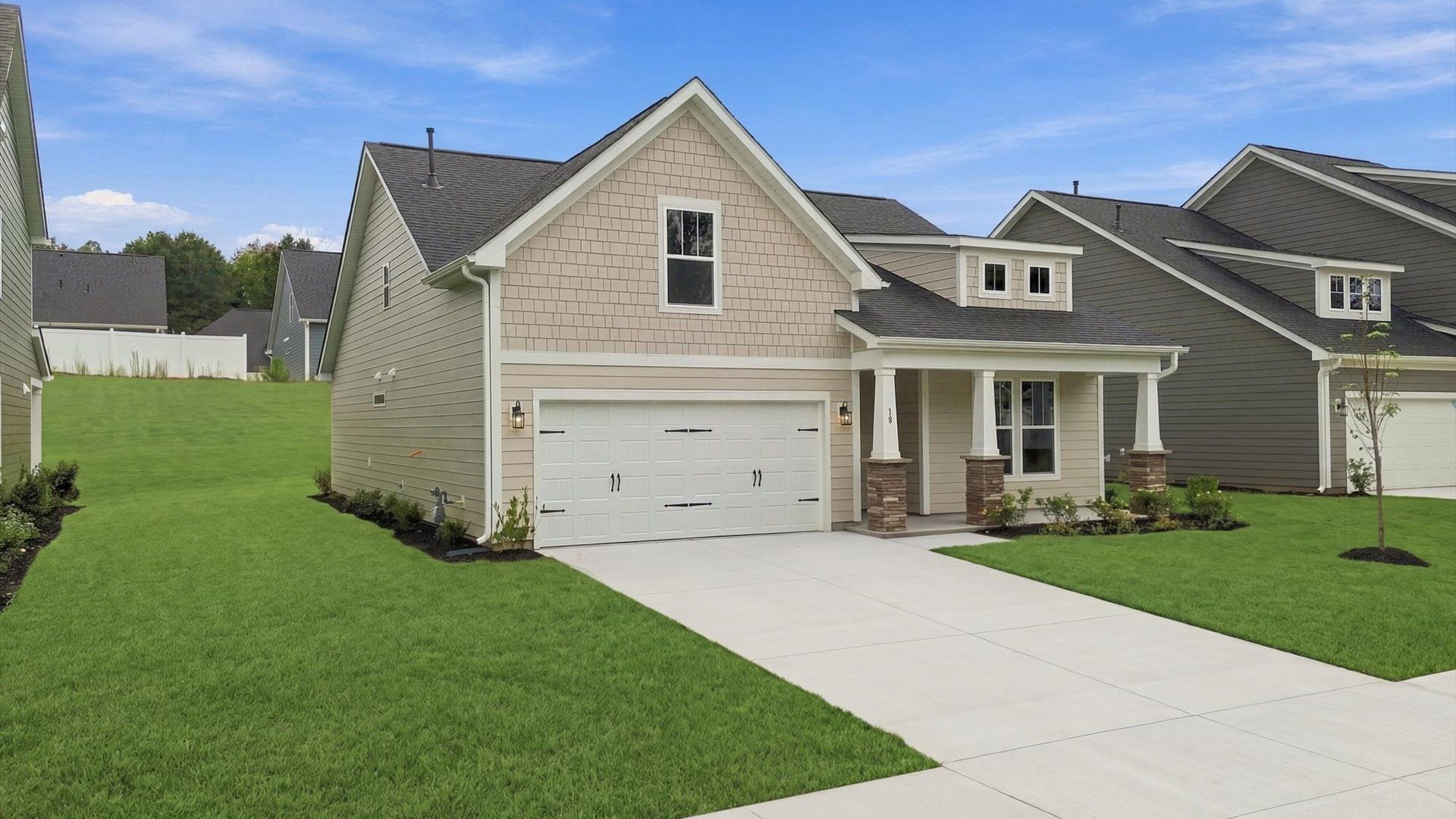 Exceptional home with tasteful exterior finishes and a thoughtfully designed façade at the Creeks at Midway community