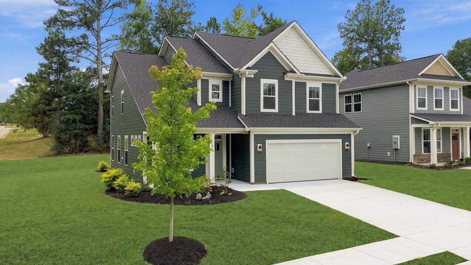 Exclusive DRB Homes exterior with balanced proportions and vibrant curb appeal