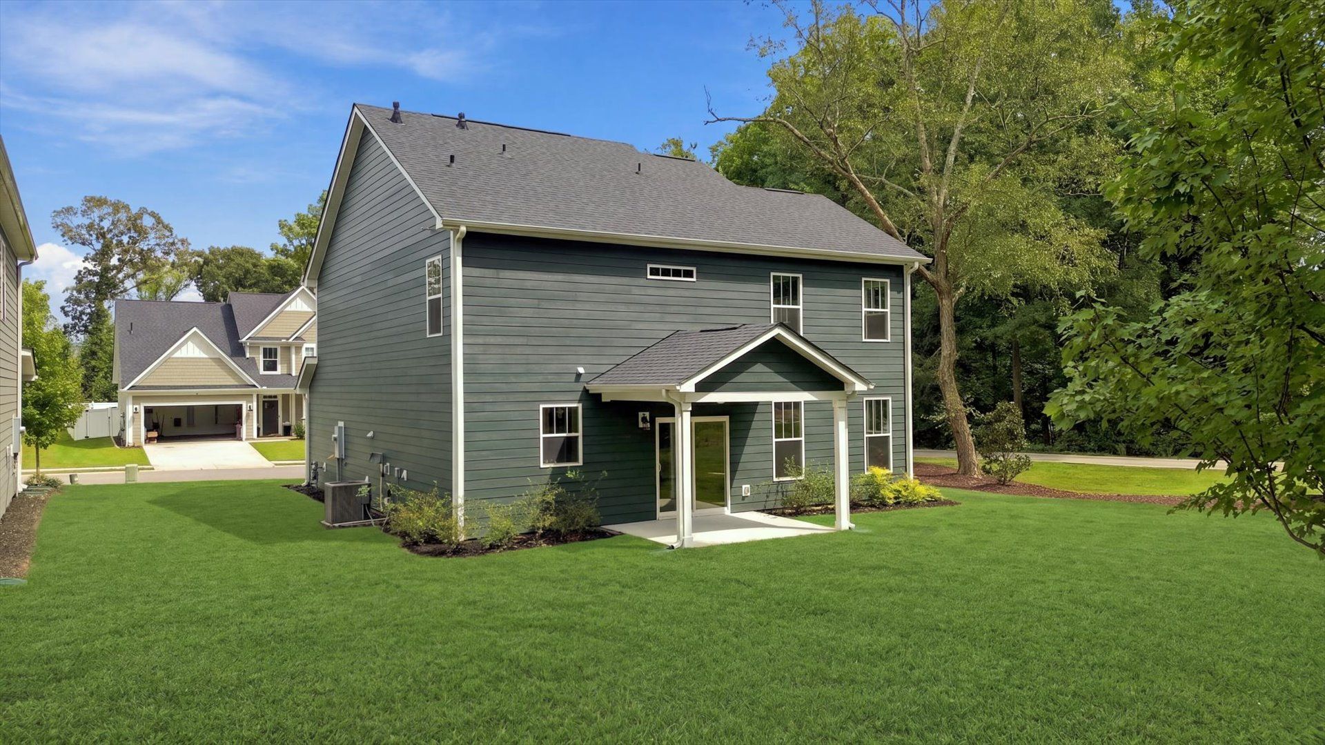Elegant exterior with a rear covered porch—perfect for relaxing or entertaining outdoors near Lake Hartwell
