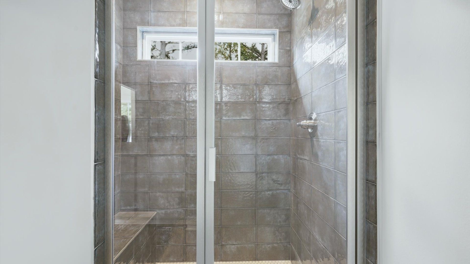 Superior en-suite primary bathroom with a walk-in shower—crafted with high standards in mind by DRB Homes