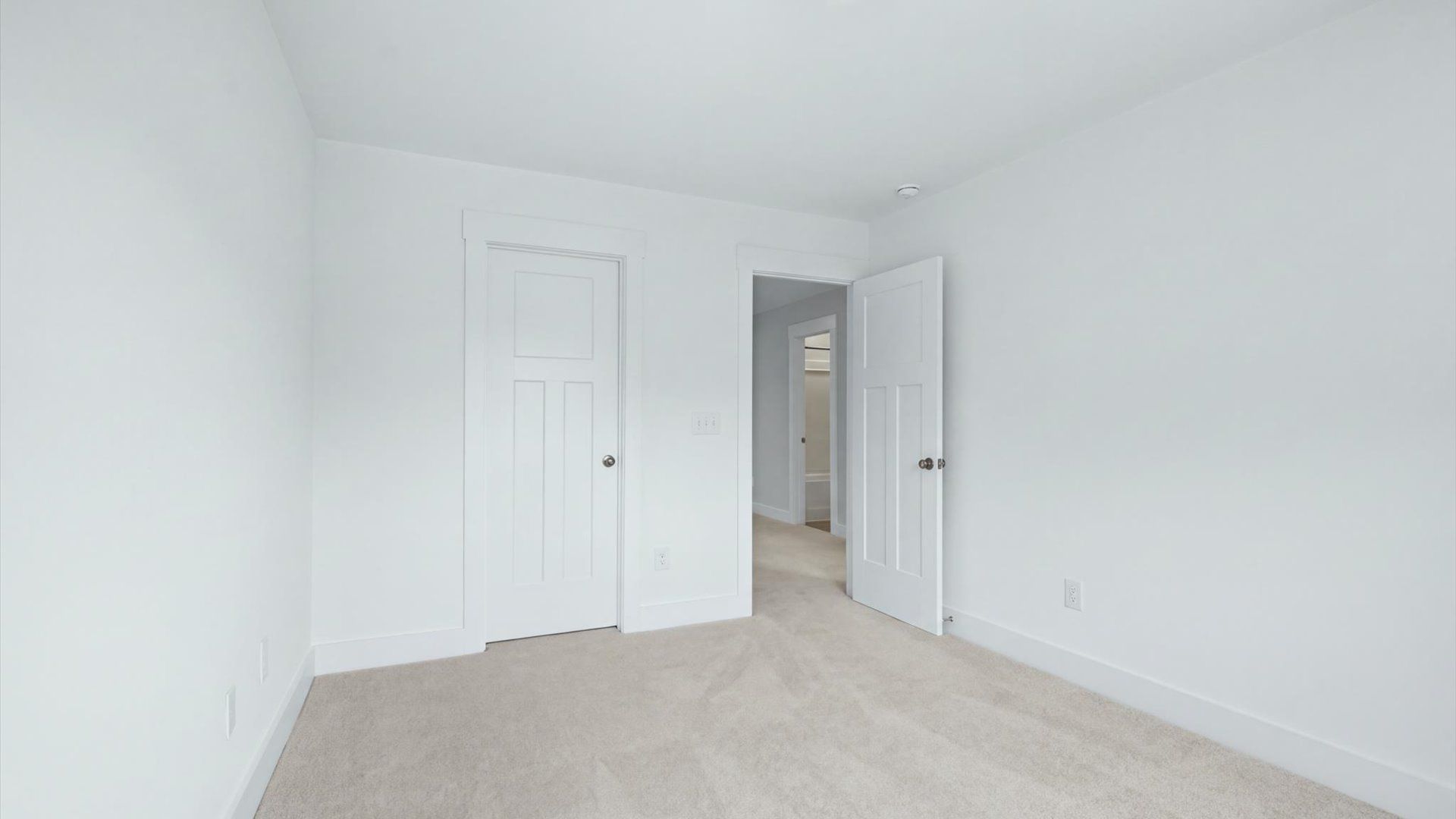 Beautifully appointed bedroom with inviting finishes and impressive closet capacity