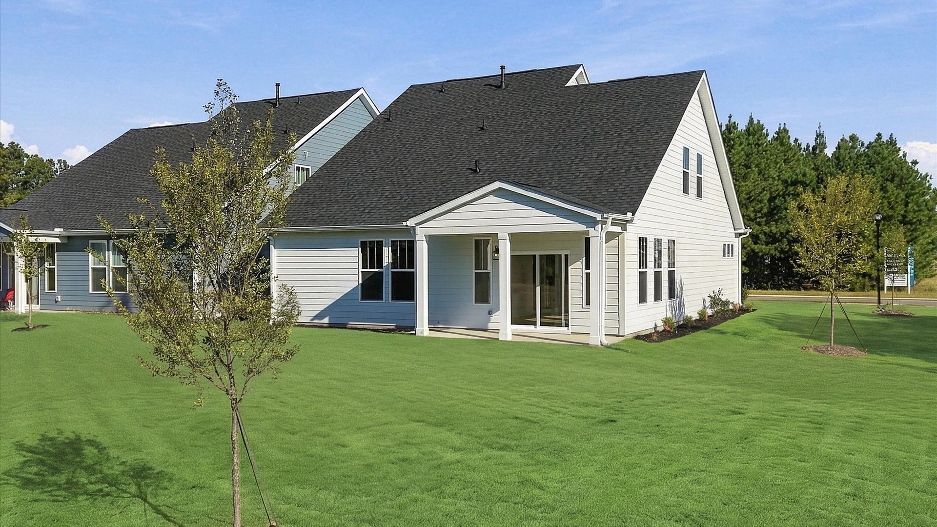 Exceptional outdoor living begins with a covered back porch in this thoughtfully designed home in Fountain Inn, SC