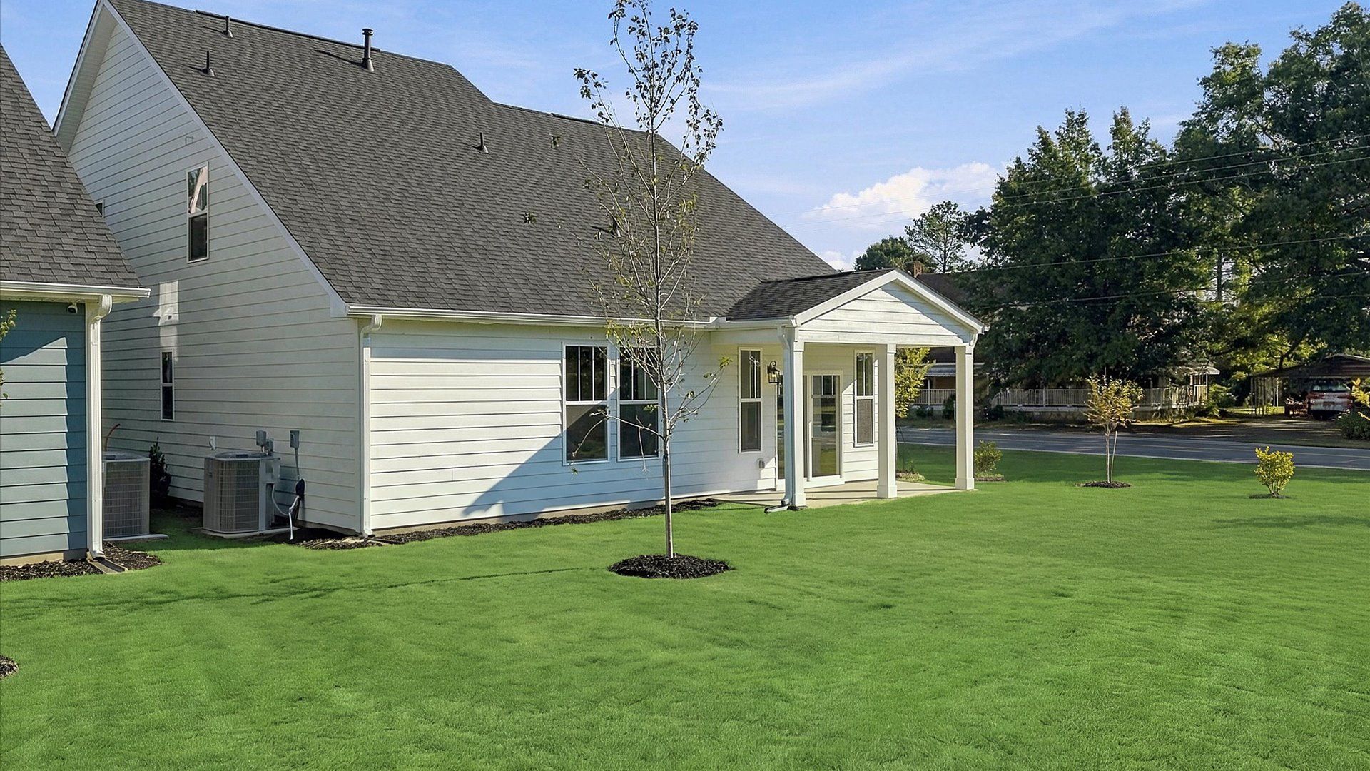Elegant exterior with a rear covered porch—perfect for relaxing or entertaining outdoors at Barton Hollow