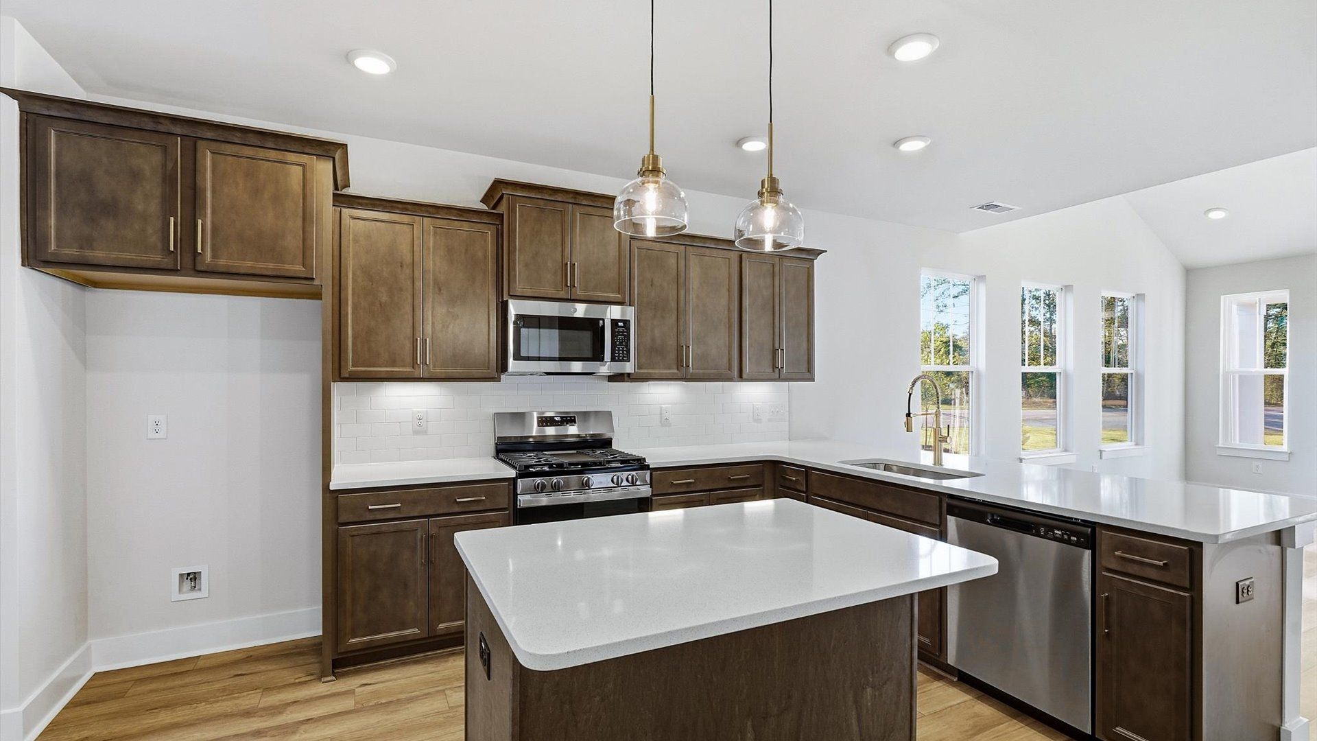 Vibrant kitchen layout with a center island, refined finishes, and open-concept flow in Fountain Inn, SC