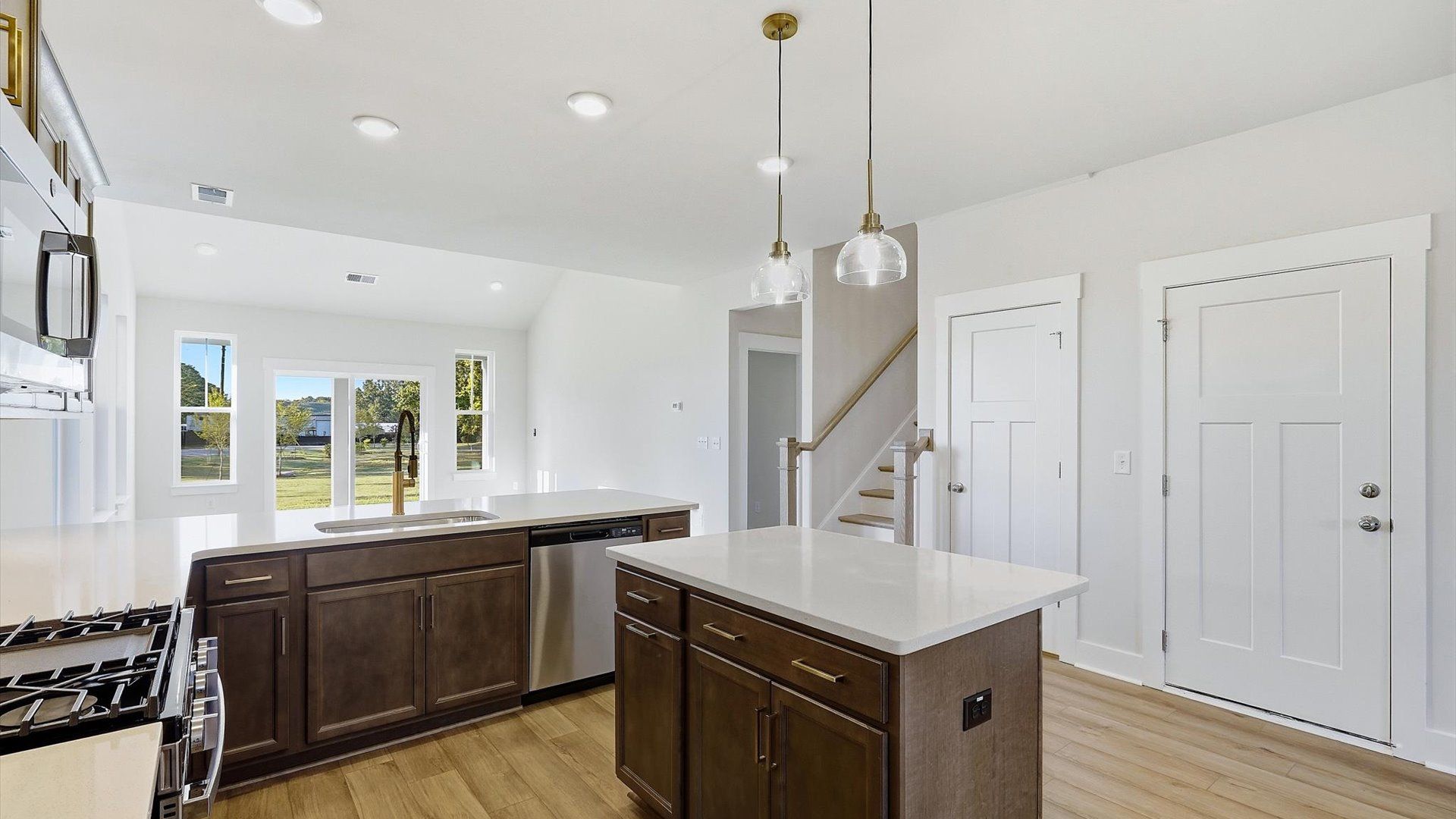 Exclusive kitchen design with center island, pendant lights, and tasteful finishes throughout at Barton Hollow