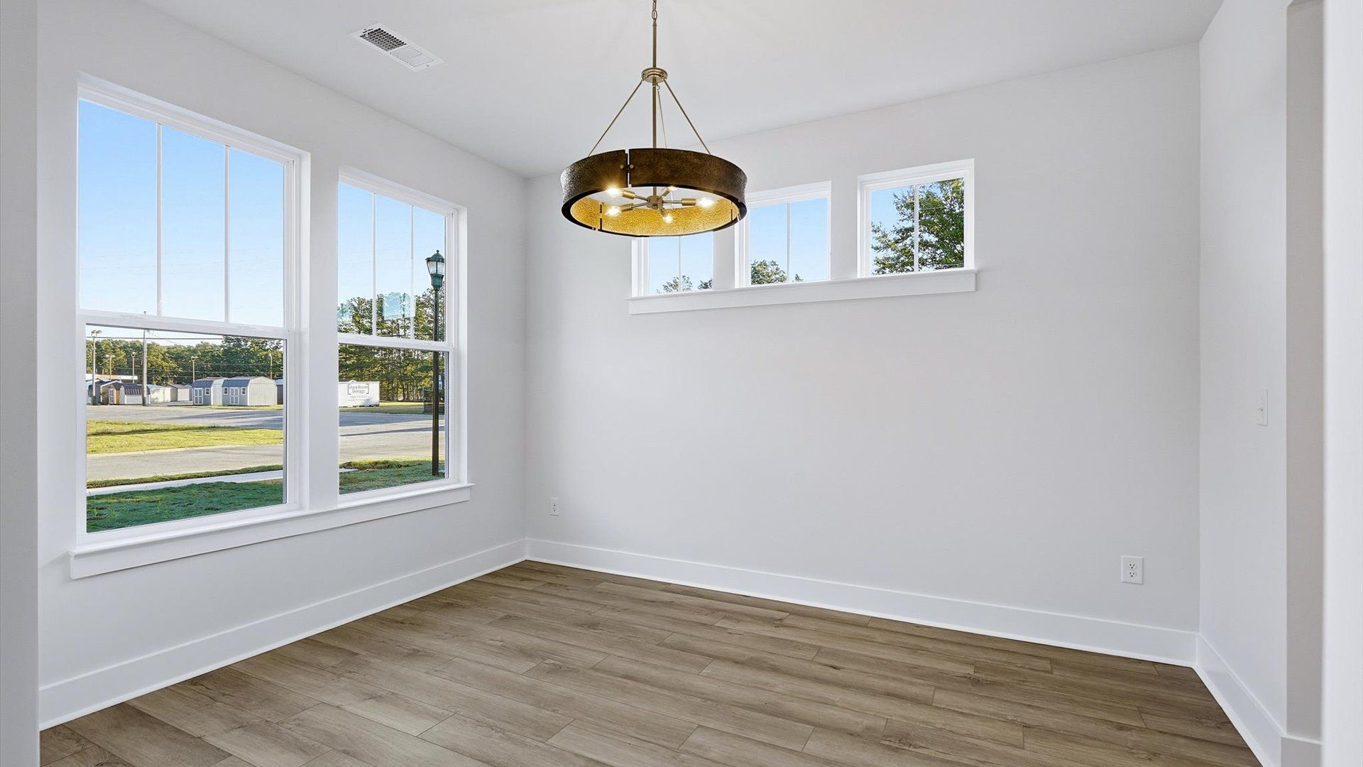 Established charm meets modern elegance in this first-rate dining room by DRB Homes