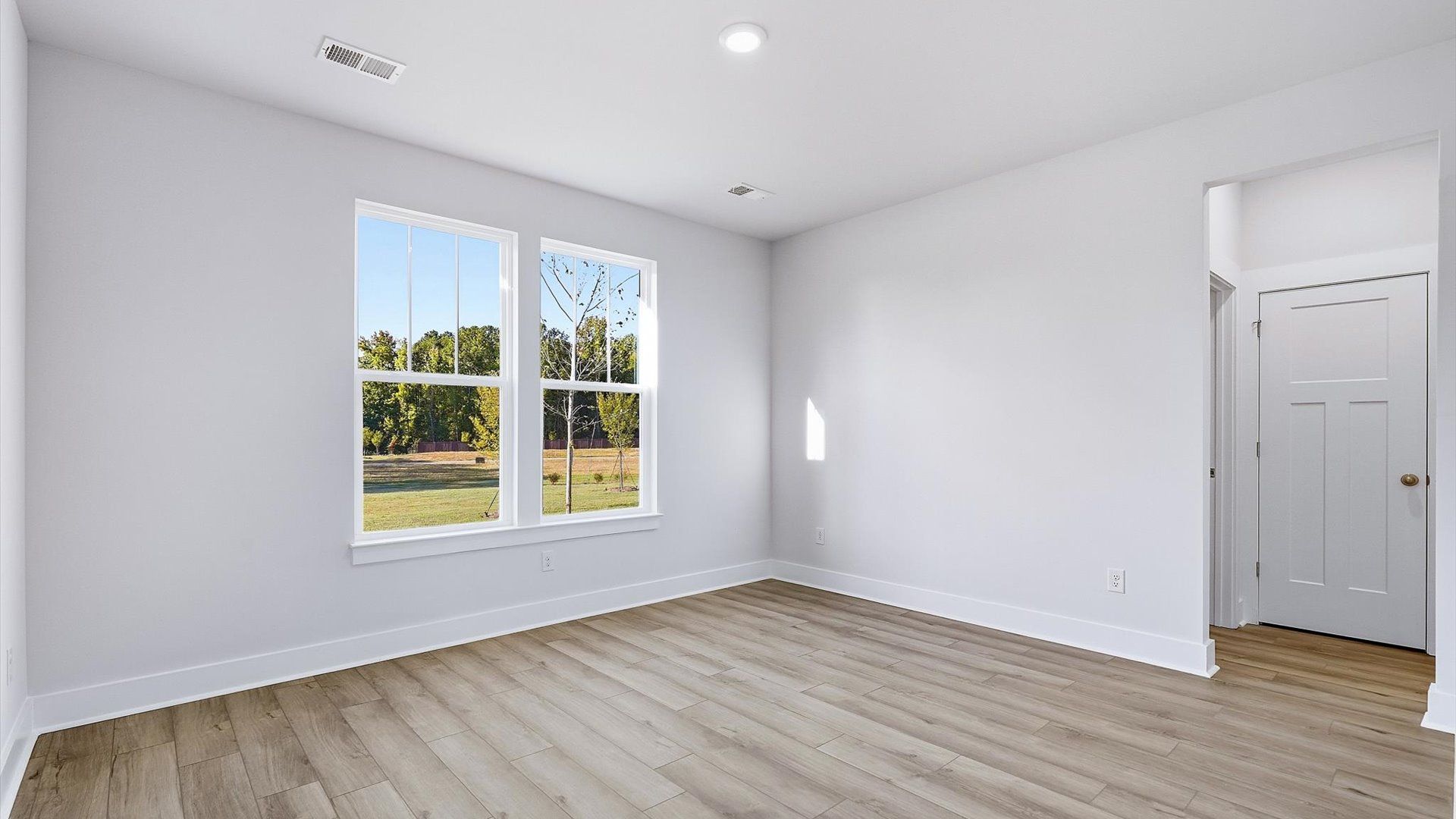 Primary suite that offers first-rate relaxation with established style and elevated finishes by DRB Homes