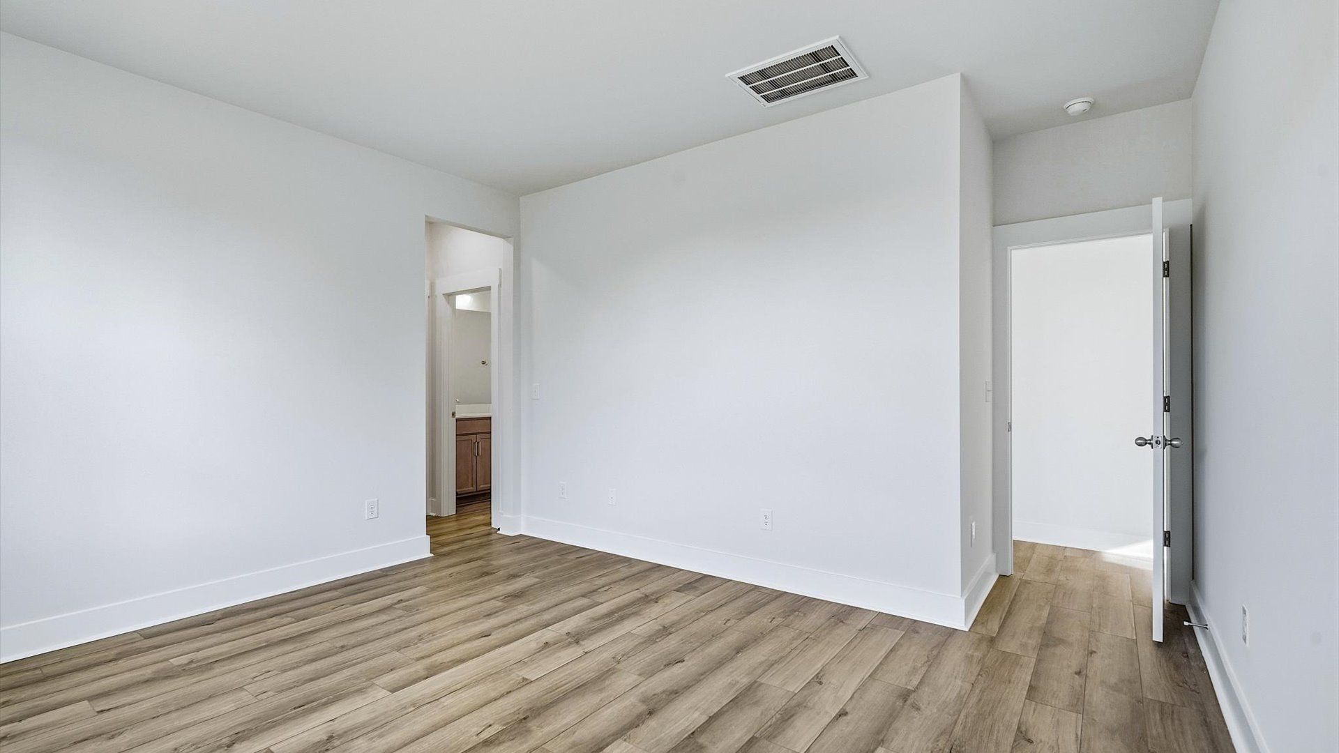 First-class hardwood floors and tasteful finishes elevate the private retreat of this exceptional primary suite in SC