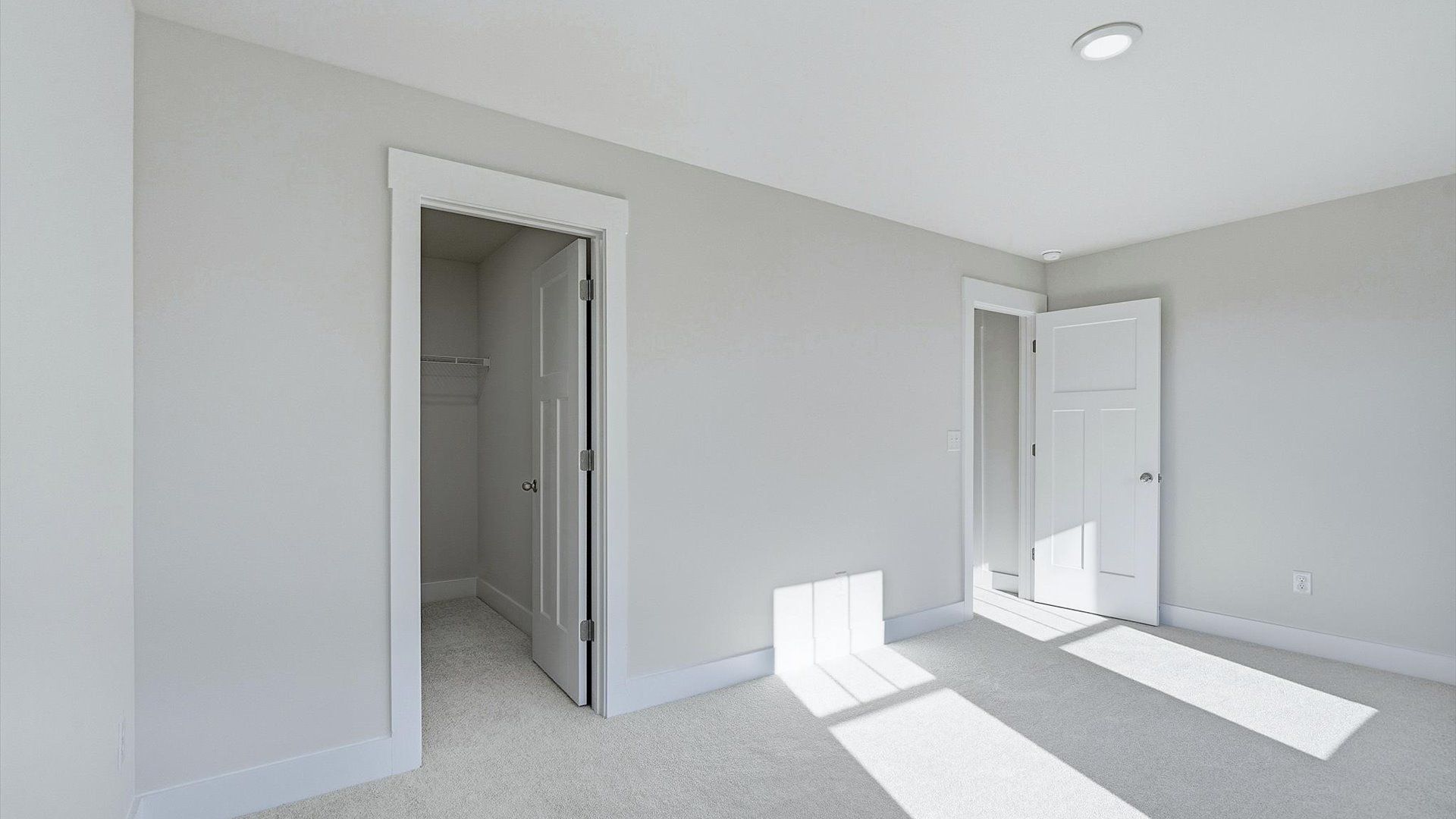 First-class secondary bedroom with comfortable carpeted flooring and generous closet space at Barton Hollow