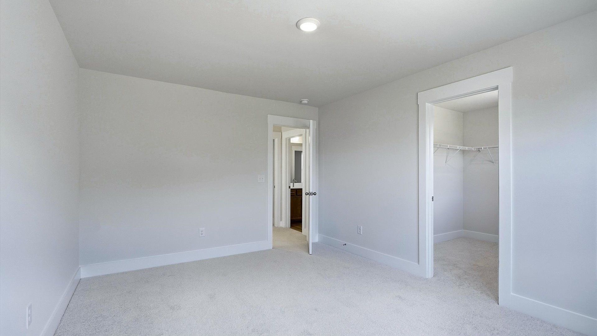 Memorable space offering plush carpet underfoot and a thoughtfully planned walk-in closet by DRB Homes
