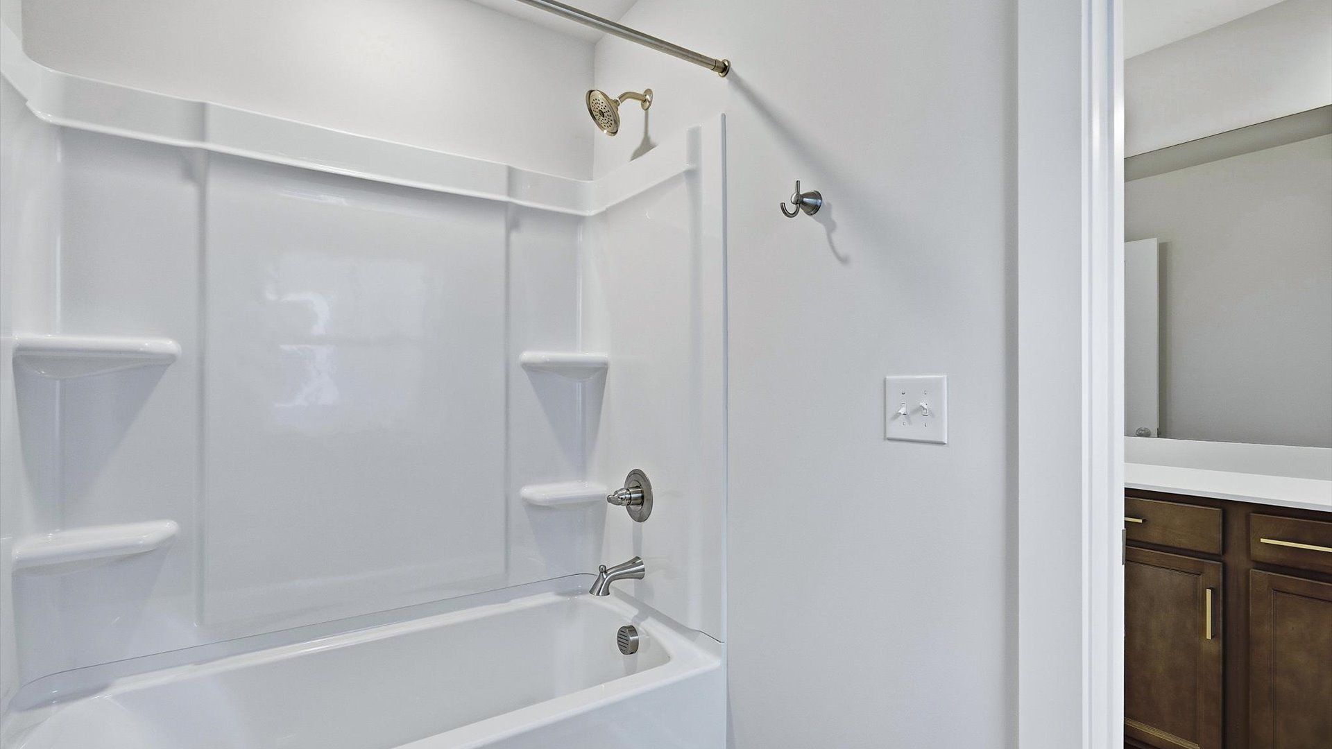 Accomplished full bath designed with both comfort and sophistication in mind by DRB Homes