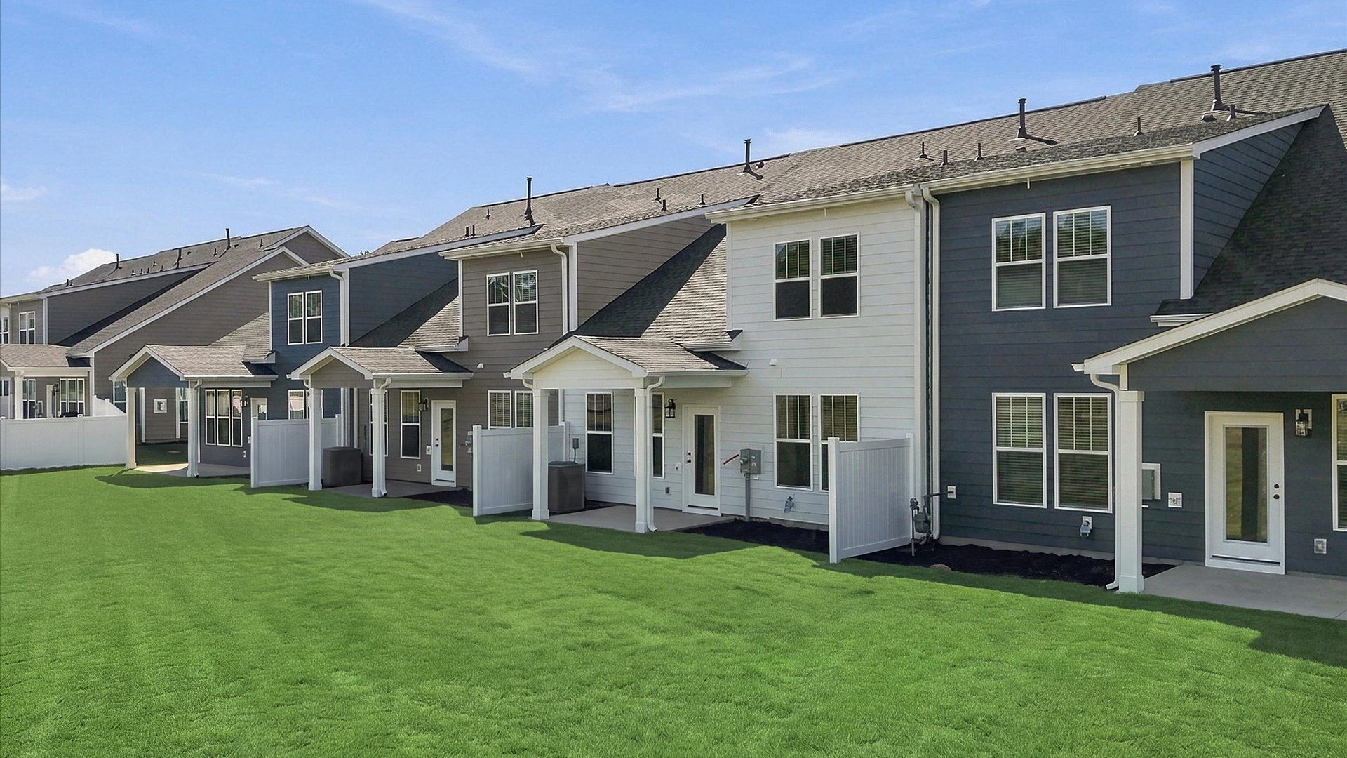 Vibrant rear outdoor space featuring a covered porch and exceptional craftsmanship at Barton Hollow