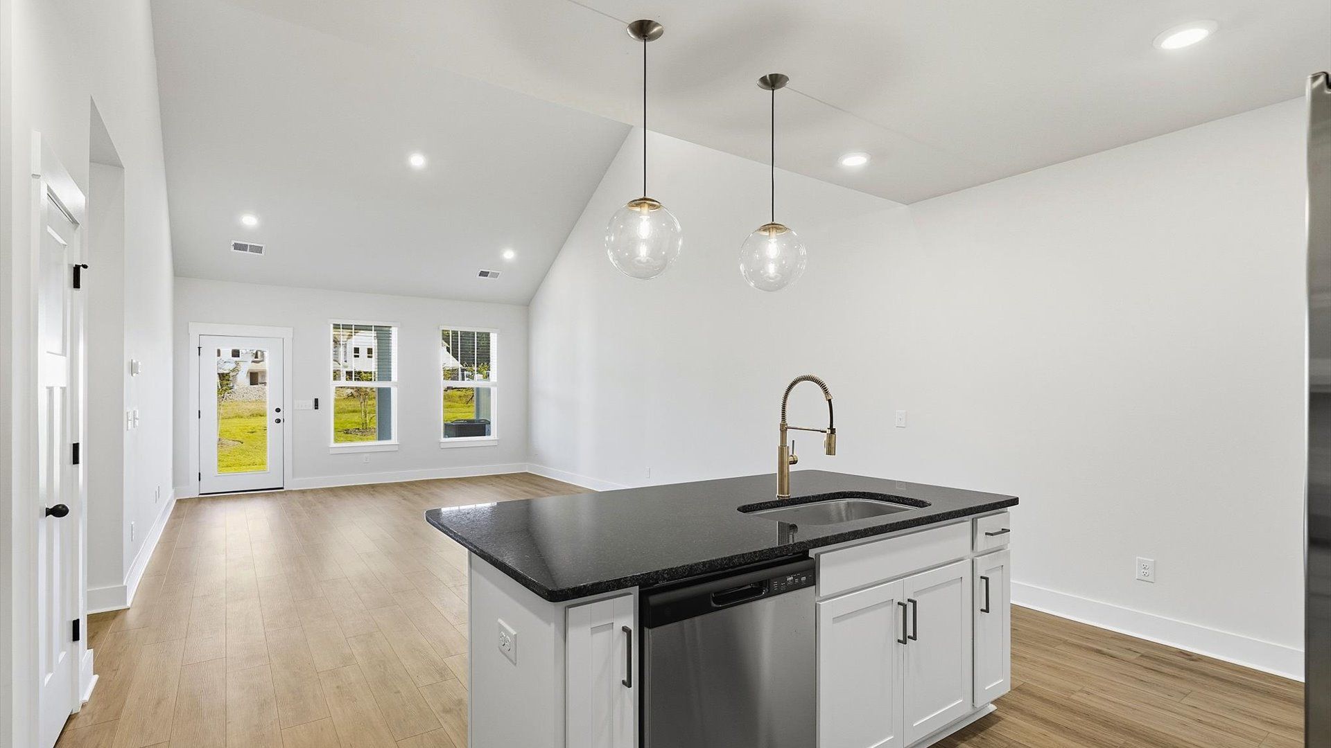 Notable kitchen space with elegant pendant lighting and a center island perfect for entertaining
