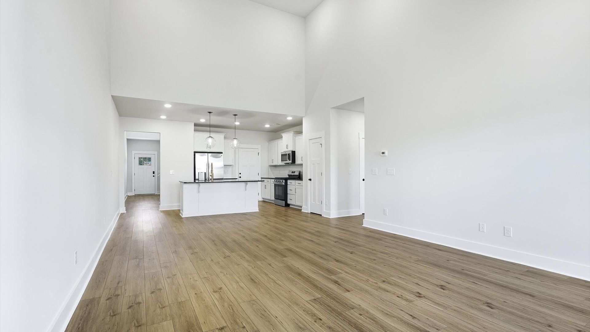 Vibrant family room with high-impact two-story ceilings and thoughtful layout for entertaining in Fountain Inn, SC