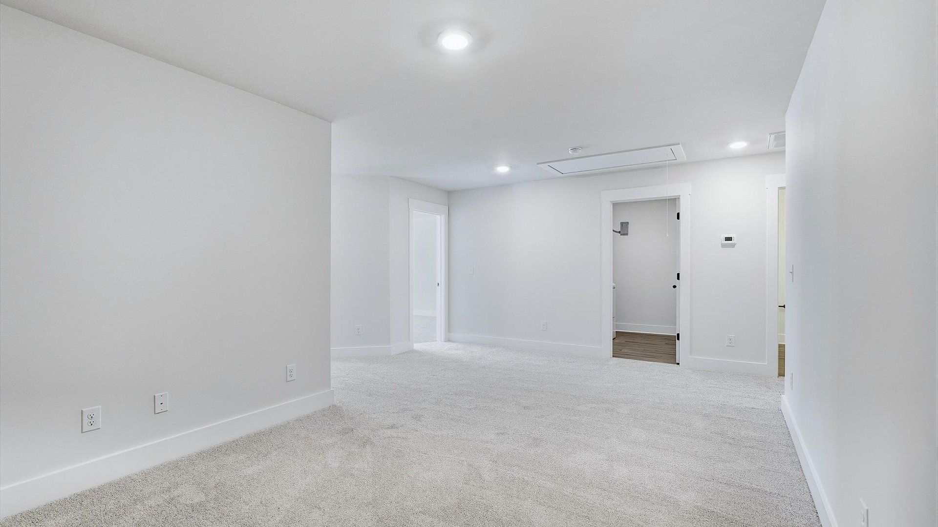 Elegant, carpeted loft that adds a superior layer of flexibility to the home’s design by DRB Homes