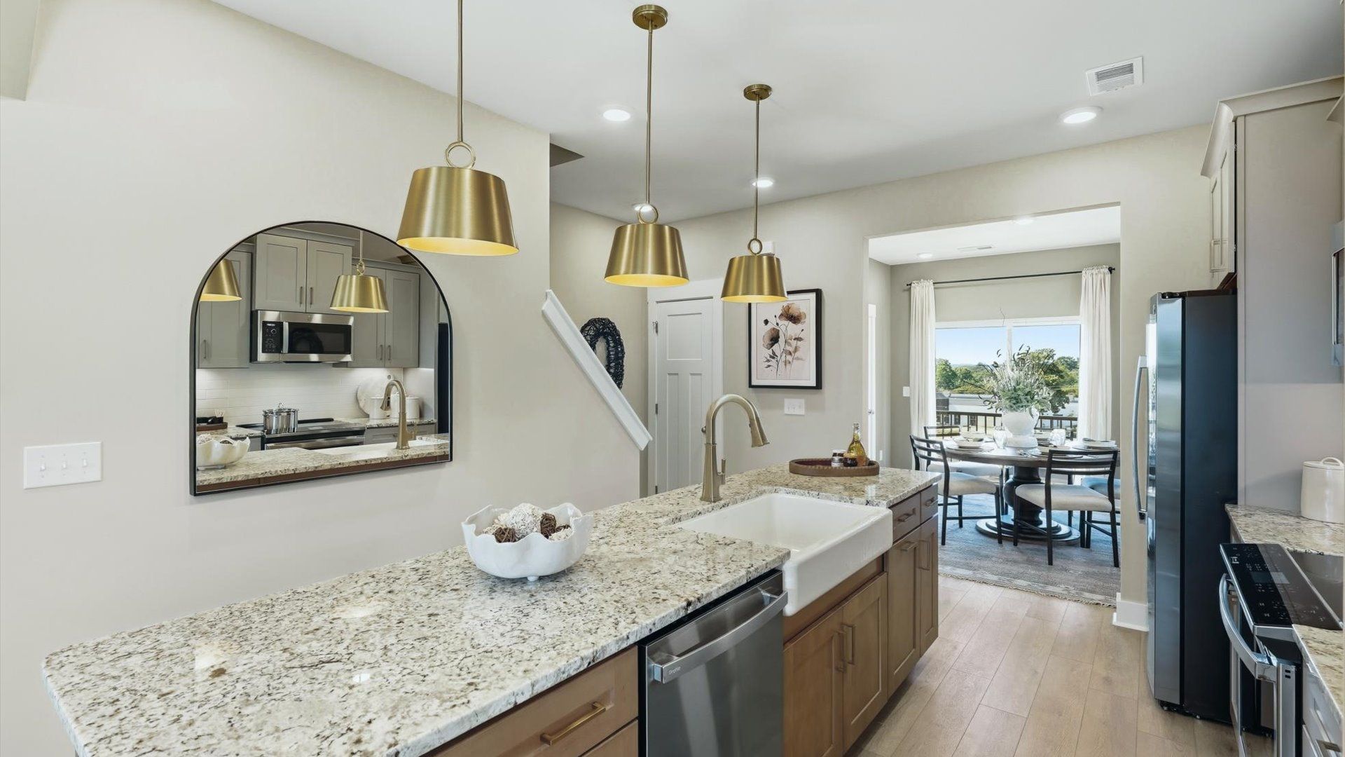 Well-designed kitchen with a center island and tasteful finishes that elevate everyday living at Traynham Place