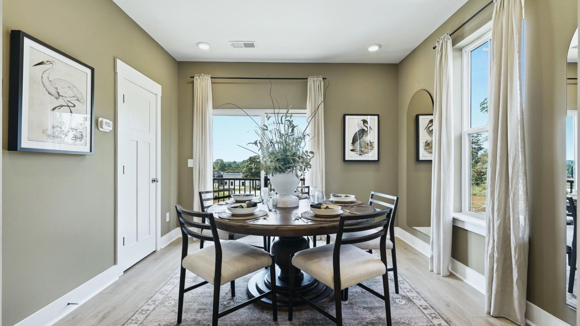 Established charm meets modern elegance in this first-rate dining room by DRB Homes