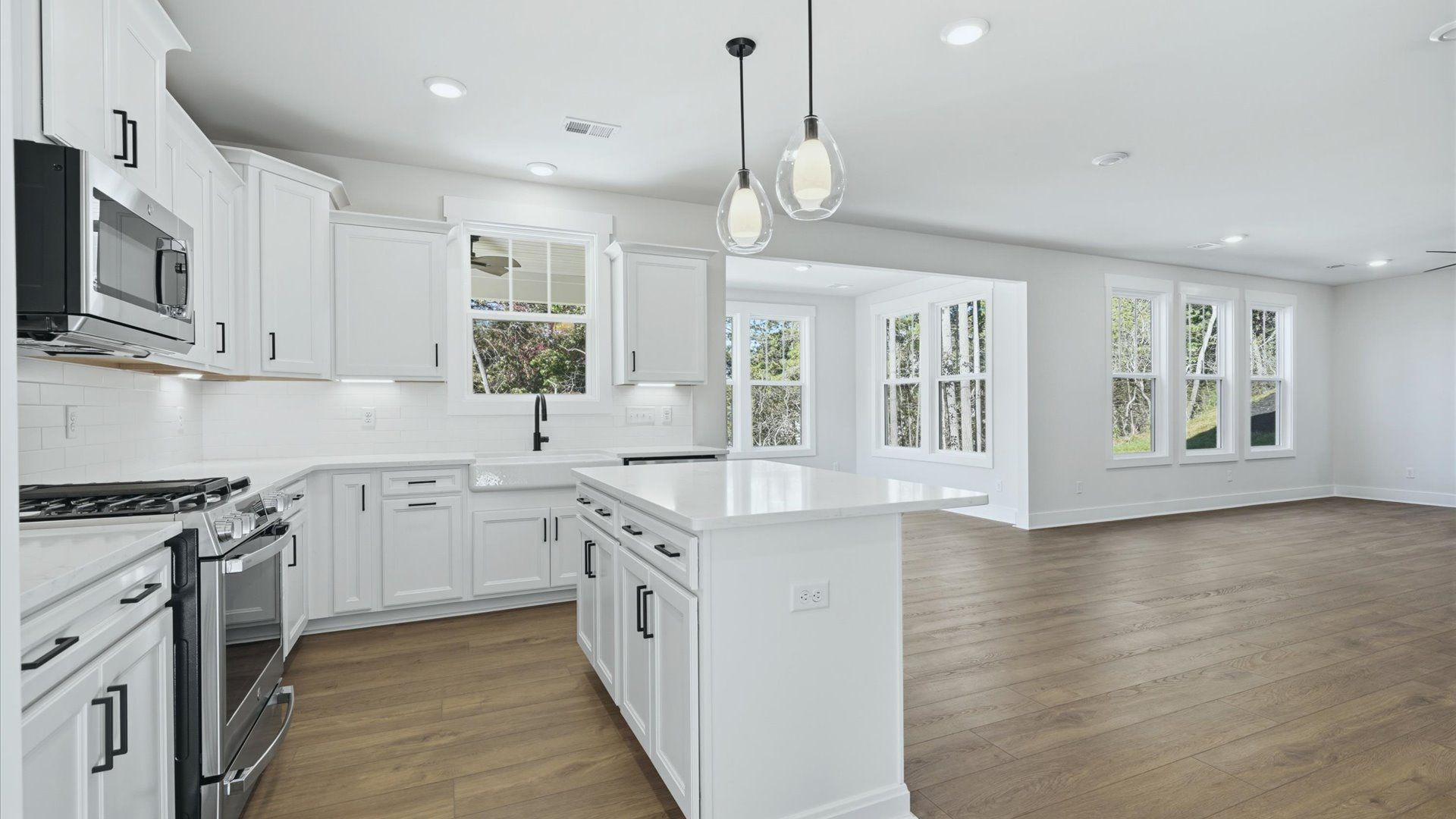 Bright and airy culinary space with generous prep areas and contemporary lighting at The Wilds at Cedar Mountain