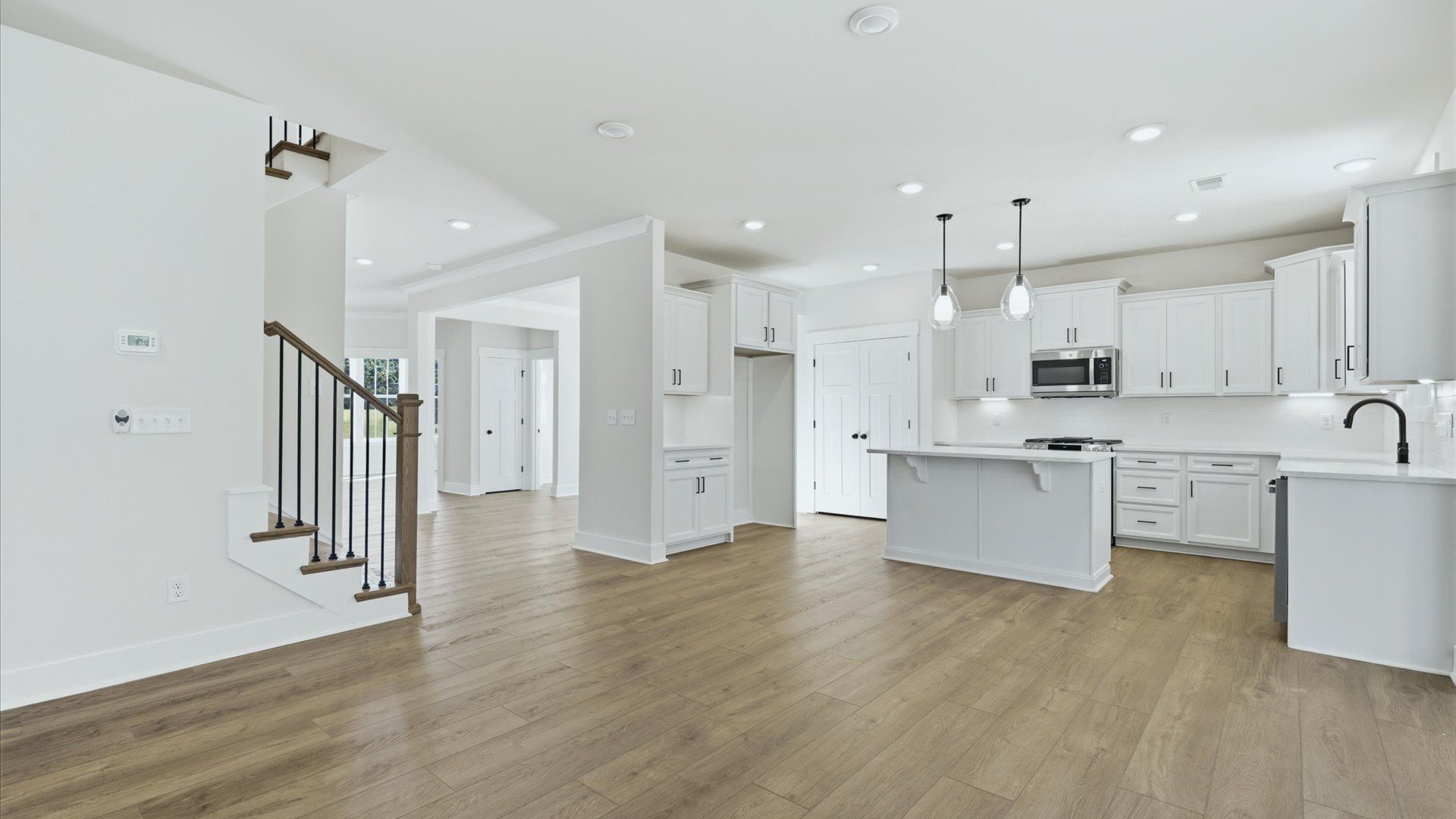 Refined family room designed to anchor the home’s open-concept layout by DRB Homes