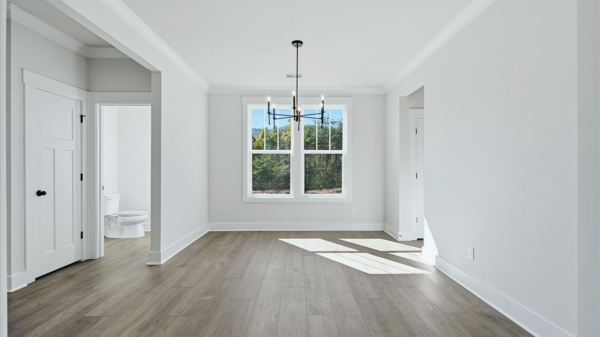 Memorable meals start in this exclusive dining space featuring elegant trim and natural light near the Blue Ridge Mountains