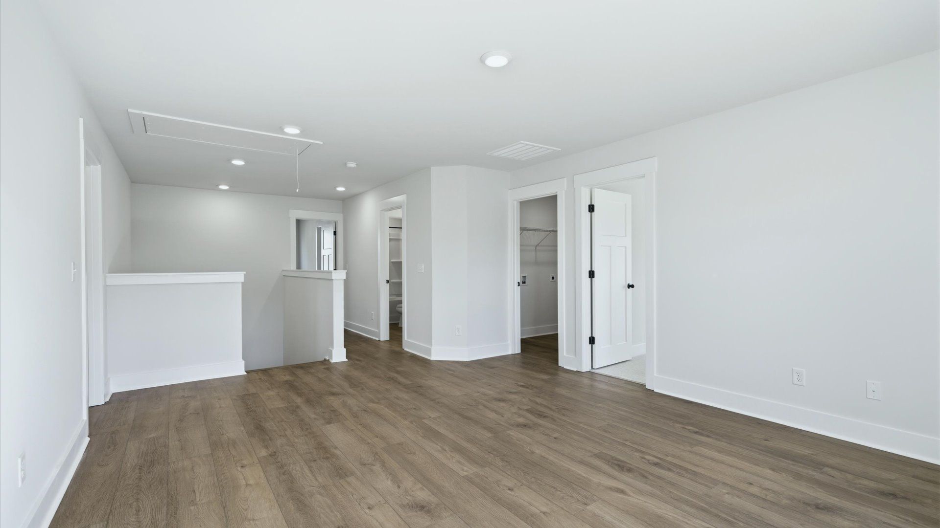 Hardwood flooring enhances the versatility of this elegant upper-level loft space at The Wilds at Cedar Mountain