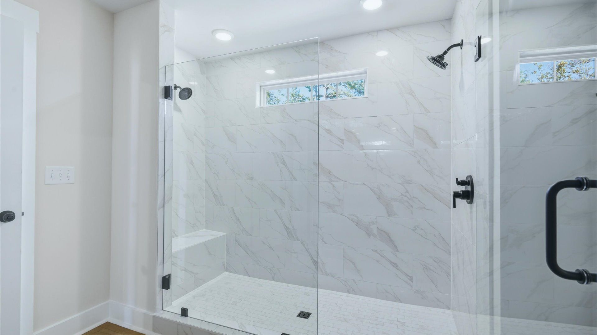 Superior en-suite primary bathroom with stylish walk-in shower—crafted with high standards in mind in Asheville, NC