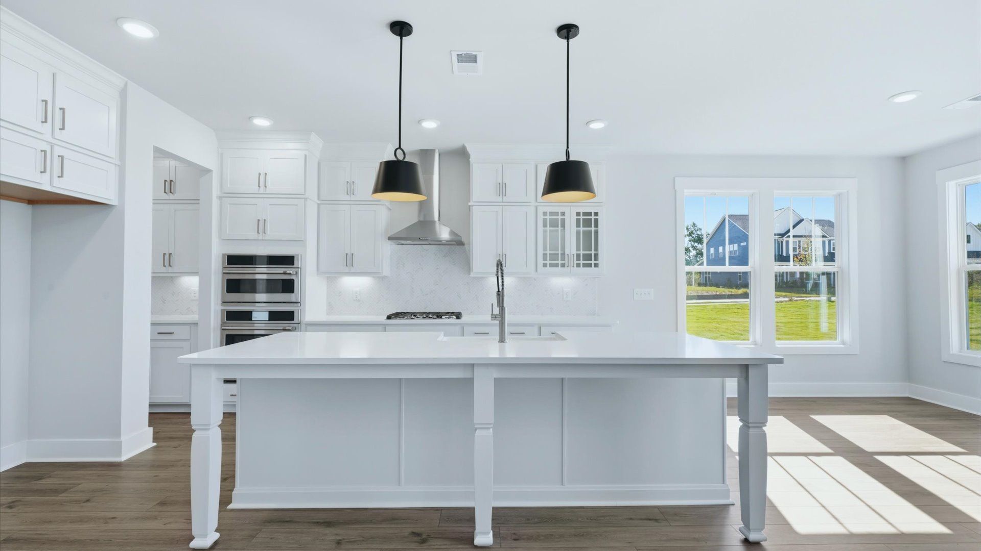 Beautifully appointed kitchen with spacious counters and sophisticated detailing by DRB Homes