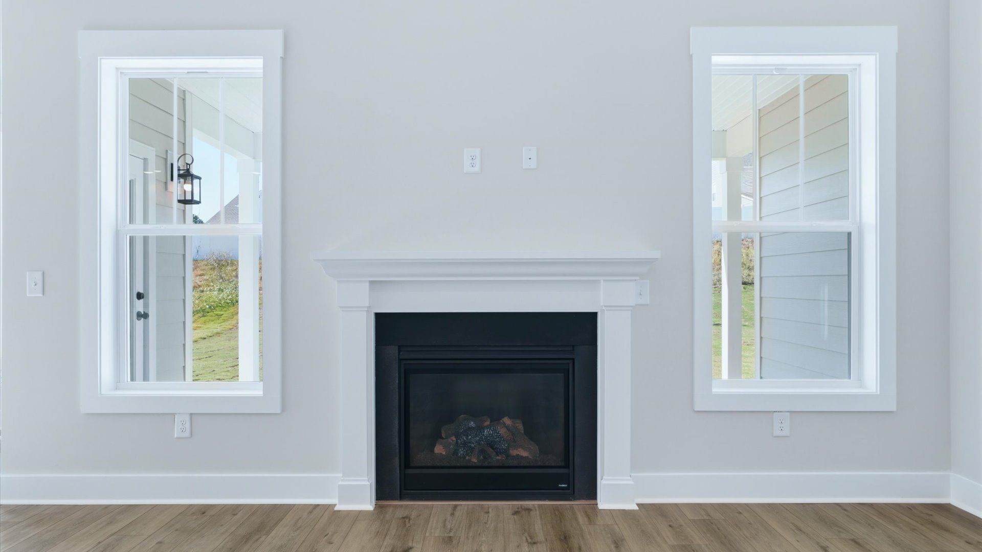 Tasteful family room with an electric fireplace, modern fixtures, and a warm, inviting feel near Lake Hartwell