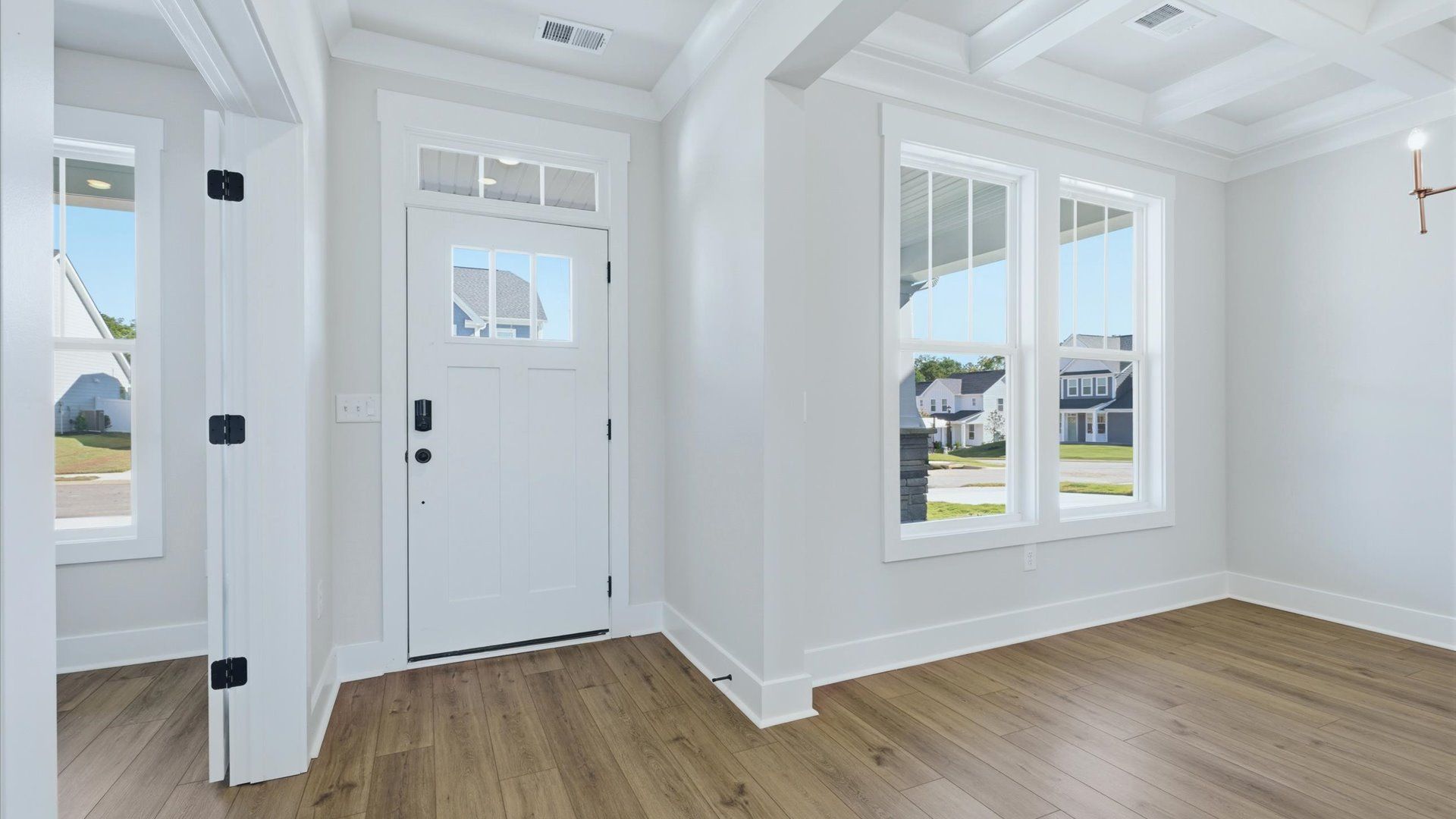 Accomplished hardwood flooring foyer sets the tone for tasteful design throughout the home near Downtown Anderson