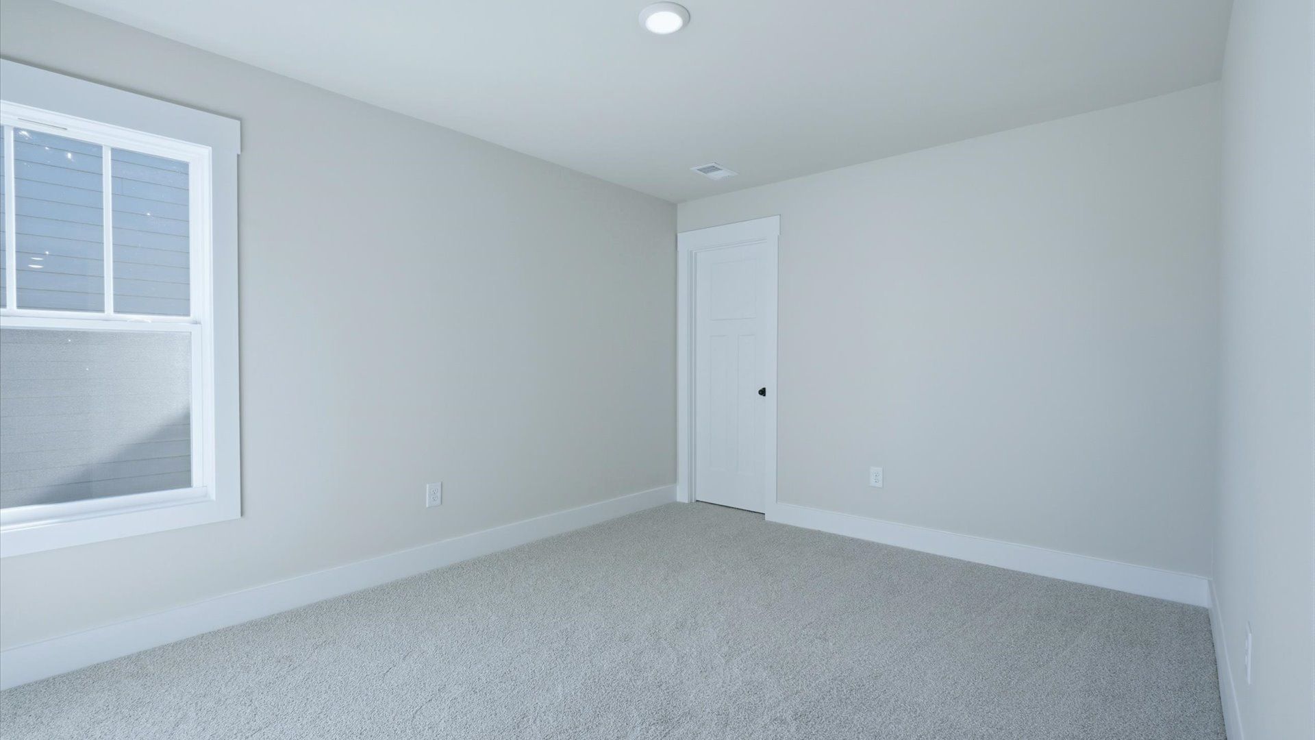 Notable secondary bedroom offering cozy carpeted flooring and a stylish walk-in closet located near Lake Hartwell