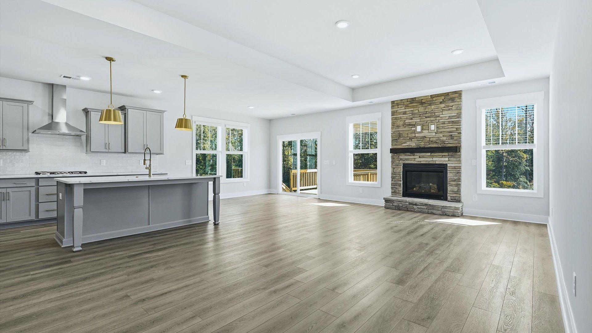 Hardwood flooring and high standards define this vibrant family room ideal for everyday living near Downtown Greenville