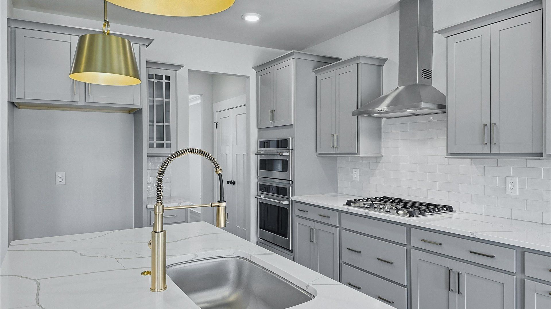 Accomplished kitchen design featuring pendant lighting above a statement island for both prep and gathering in SC