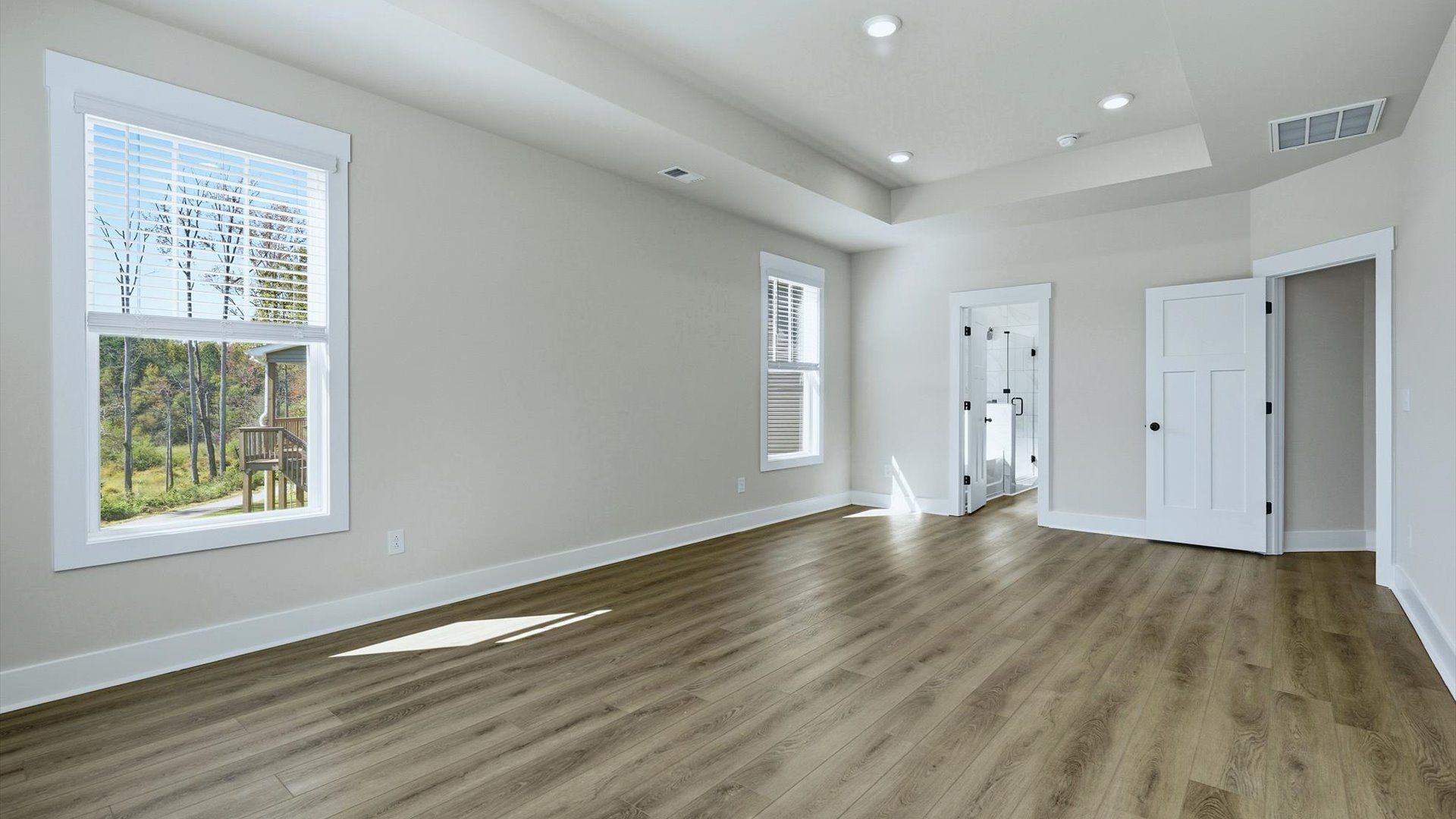 Eye-catching details and elegant finishes in the vibrant primary suite of this select home at The Reserve at Livingston Park