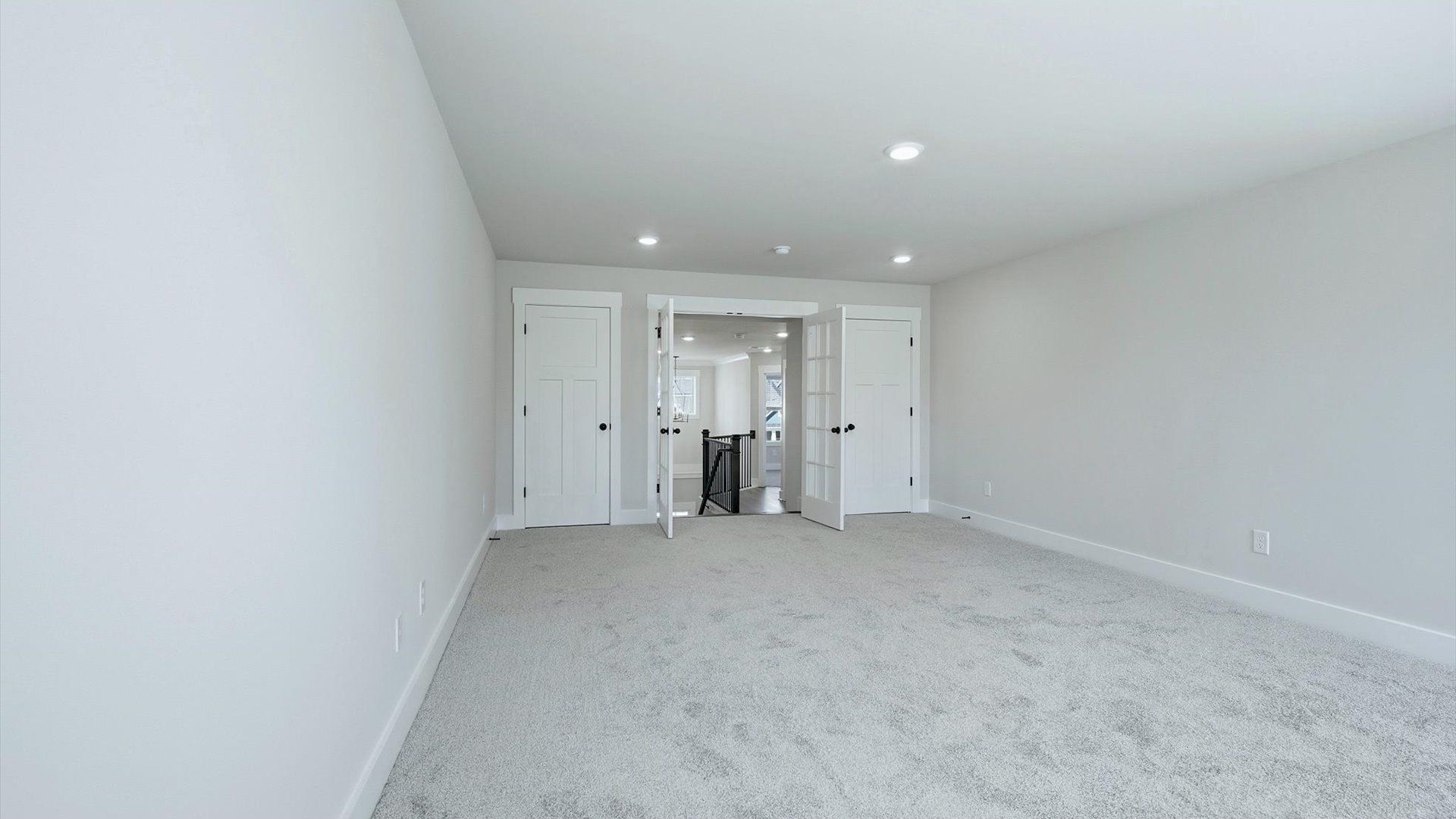 Vibrant carpeted bonus room offering flexibility as a study nook, game room, or second family space at Livingston Park