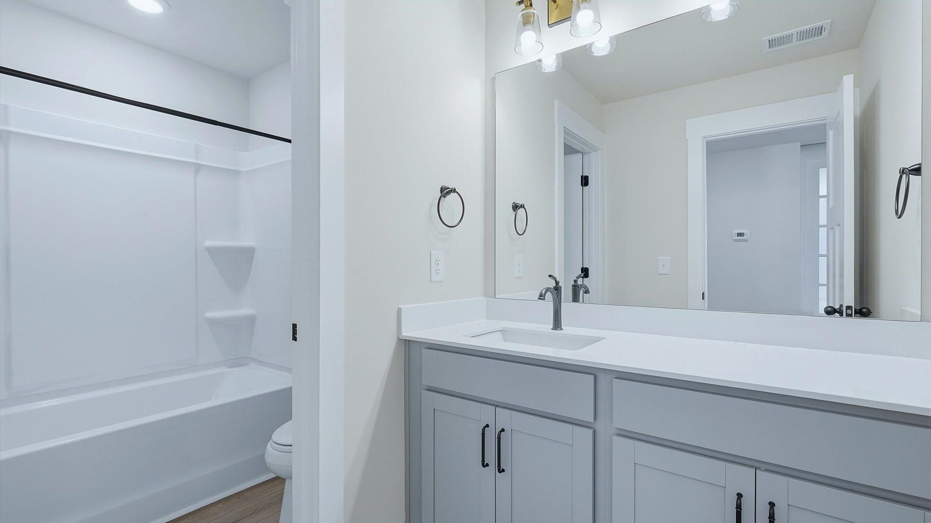 Vibrant and welcoming bathroom with elegant countertop space and polished details near Downtown Greenville