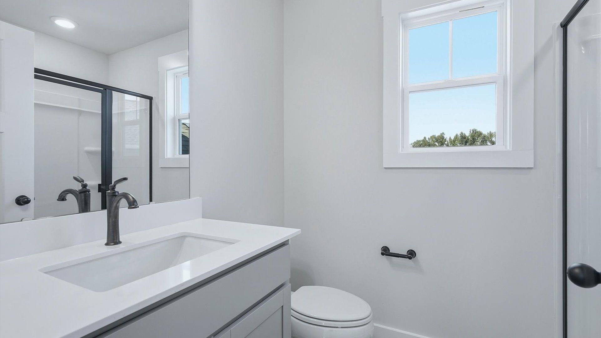 Secondary bathroom designed with a luxurious feel and practical functionality by DRB Homes