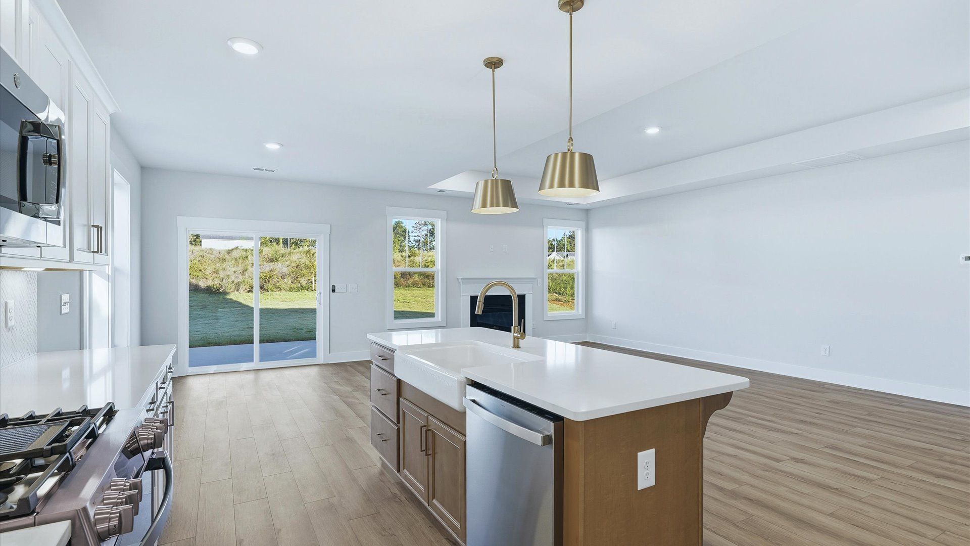 Highly skilled craftsmanship shines in this modern kitchen with pendant lighting and a central island focal point