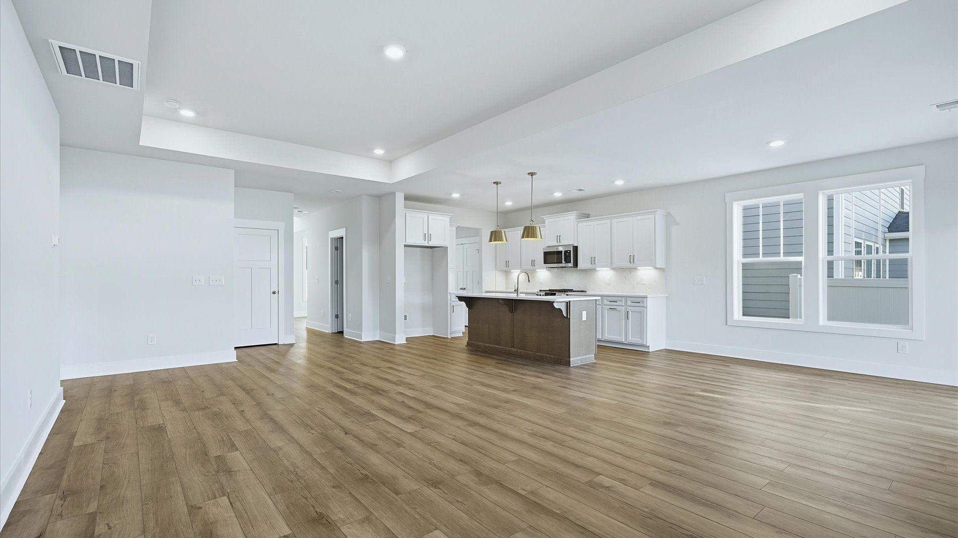 Superior design shines in this open-concept family room with timeless finishes and a modern edge at Mulberry Estates